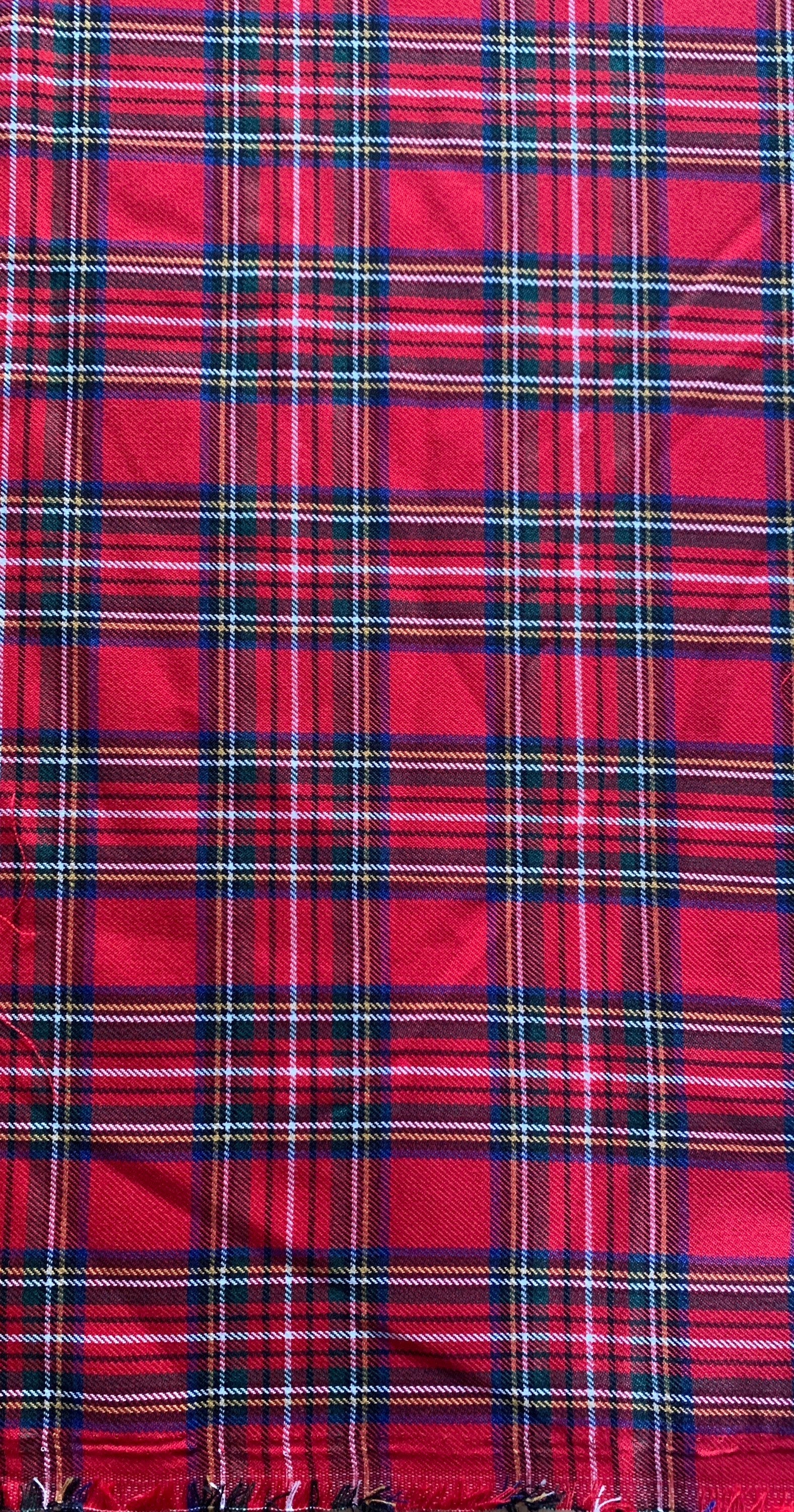 Plaid design fabric. Width 59 inches made of polyester and rayon cross dyed yarn colors in red and green.