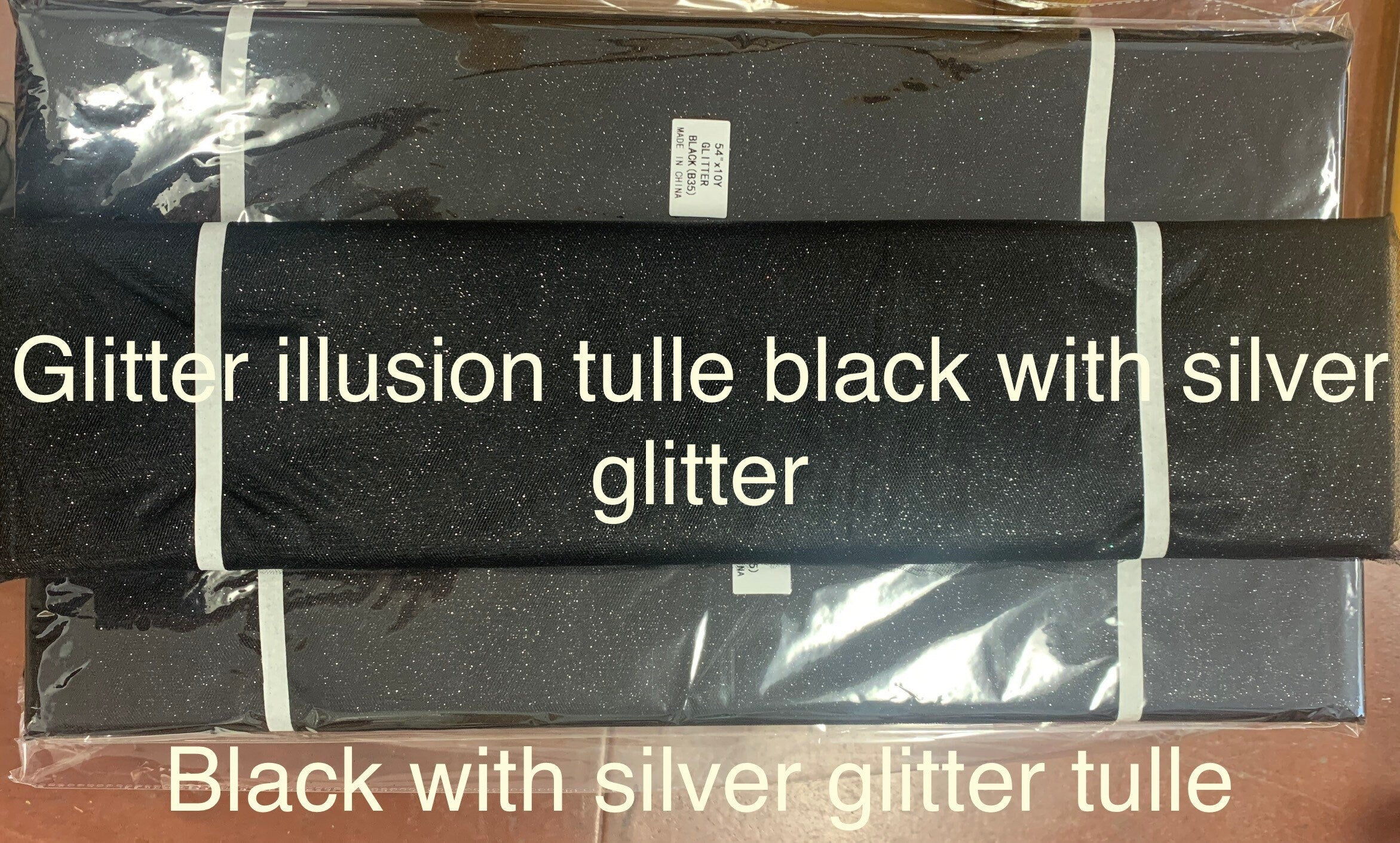 Black Glitter Tulle 54" double fold, color Black with Silver glitter 10 yards per pack.
