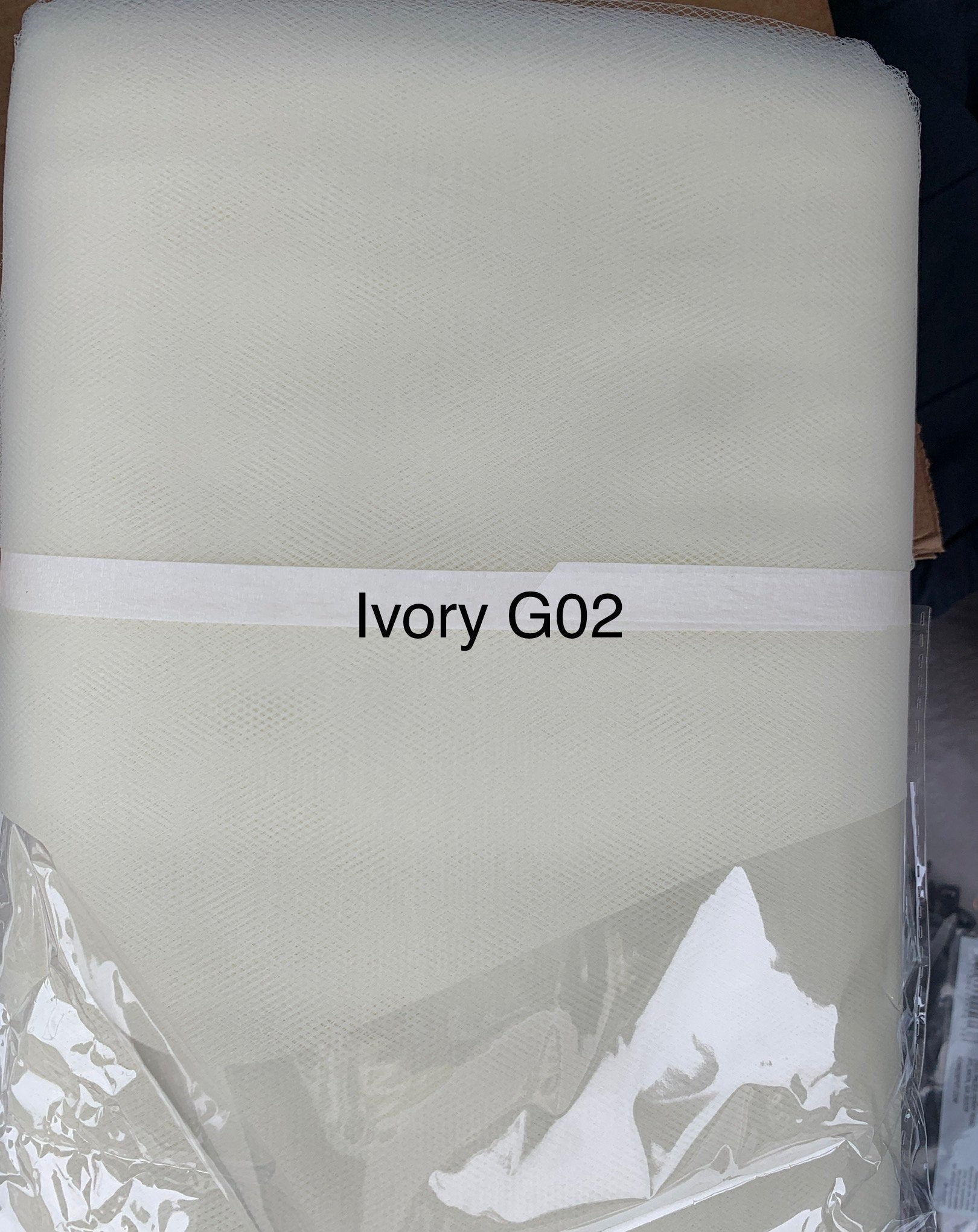 Ivory 2 and champagne tulle 54", 40 yards bolt, width 54" double fold.