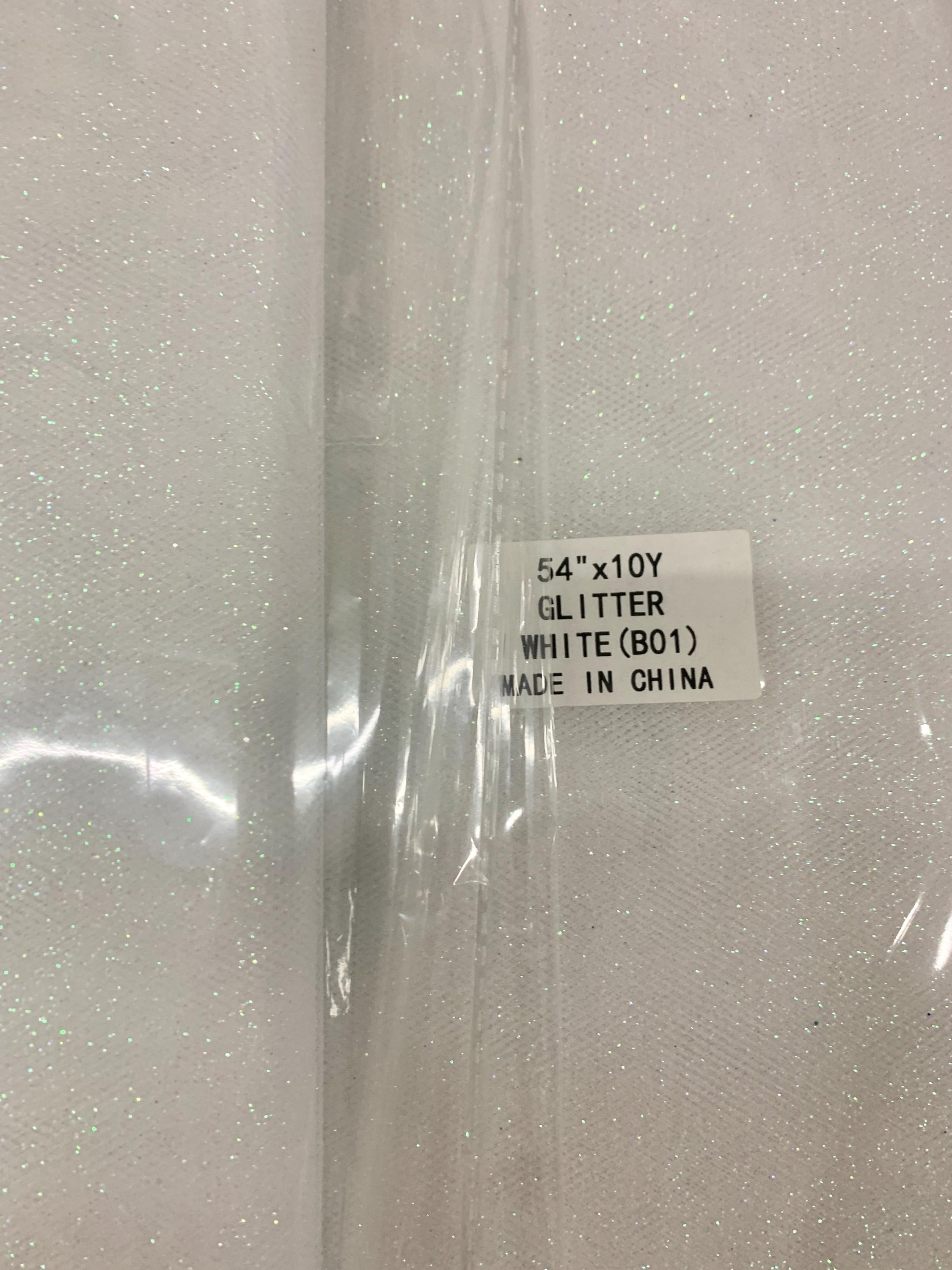 White Gliter Tulle 54" double fold white with unicorn gliter 10 yards per pack.