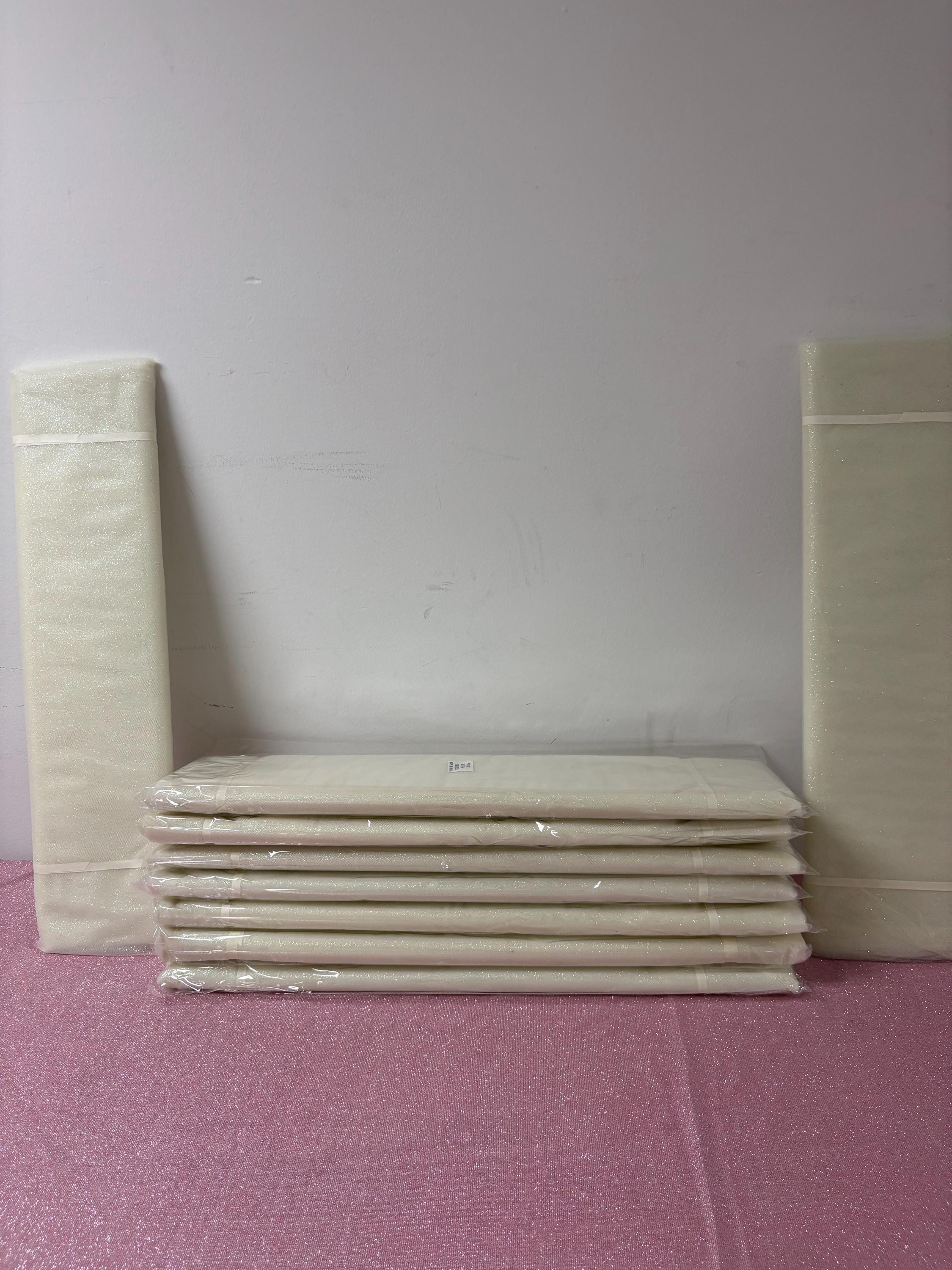 Ivory Tulle Gliter 54" double fold, color Ivory with unicorn glitter 10 yards per pack.