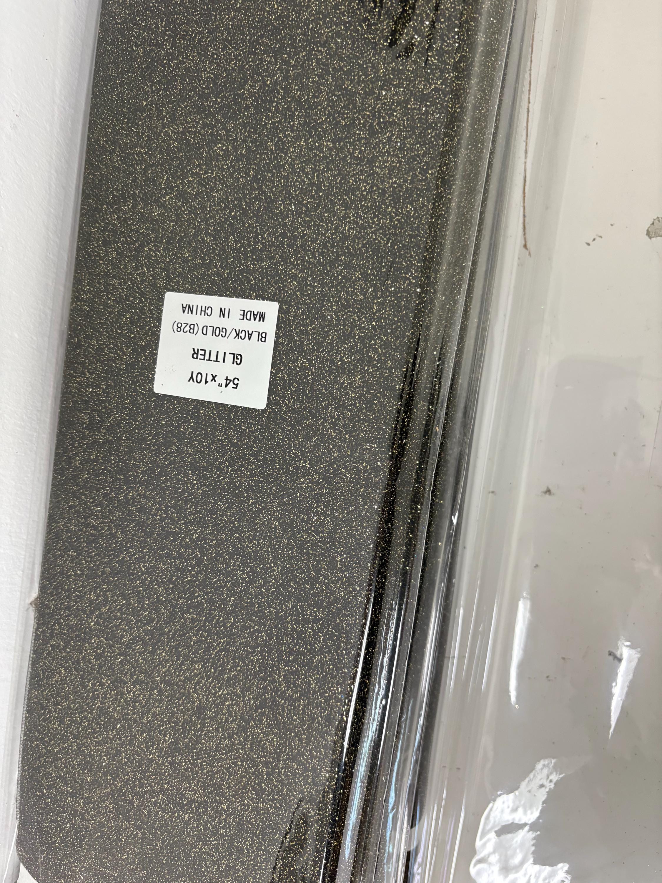 Tulle 54" Black with gold glitter 10 yards double fold.