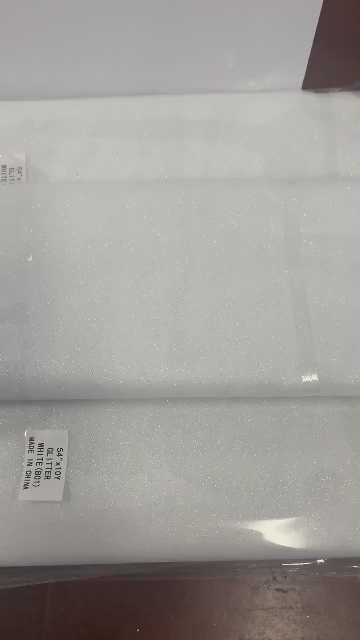 White Glitter Tulle 54" double fold, color White with unicorn glitter 10 yards per pack.