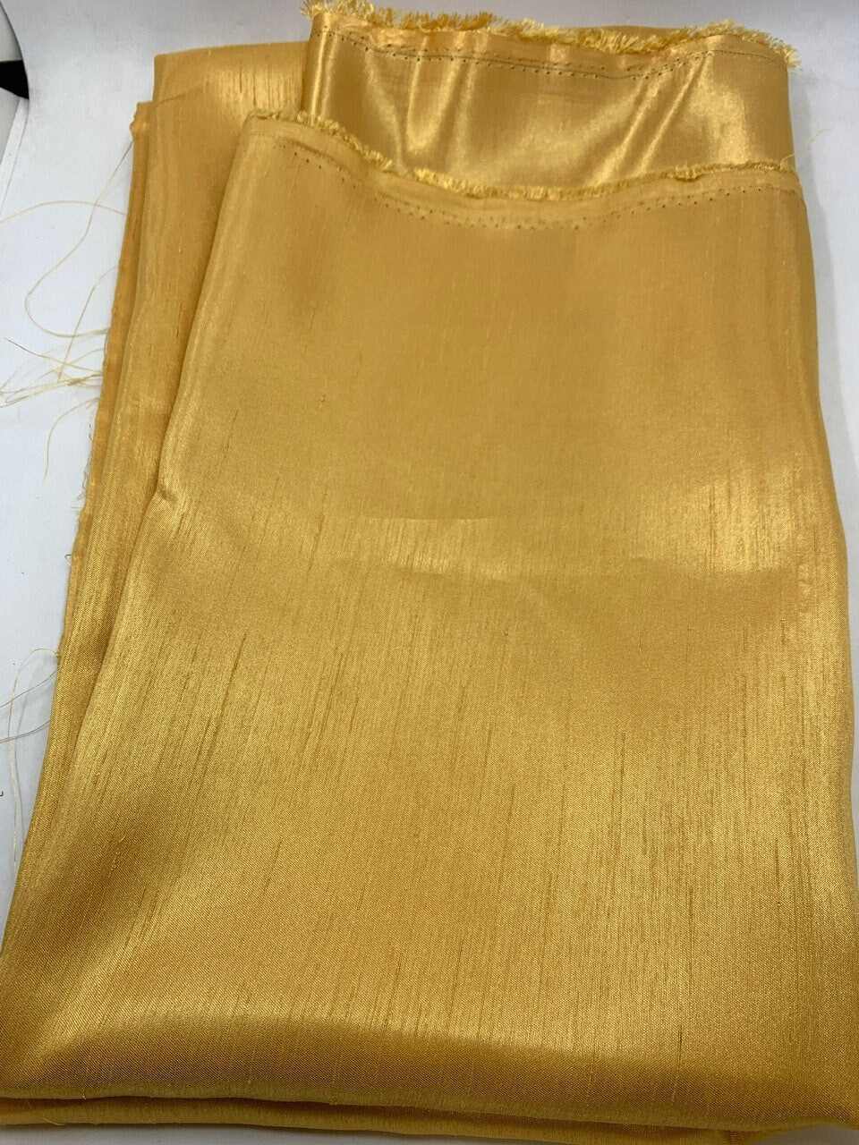 Antique Gold Slub Shantung Fabric width 58 inches polyester double sided dull and shiny.