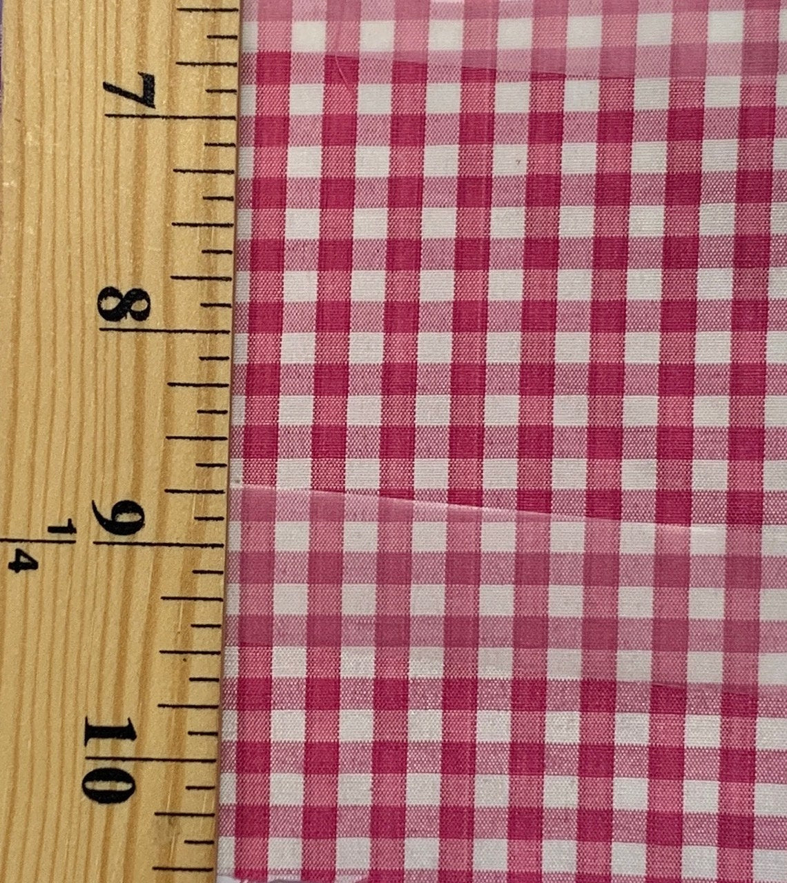 1/8" Gingham Fabric. Poly cotton, width 59 inches color fuchsia.