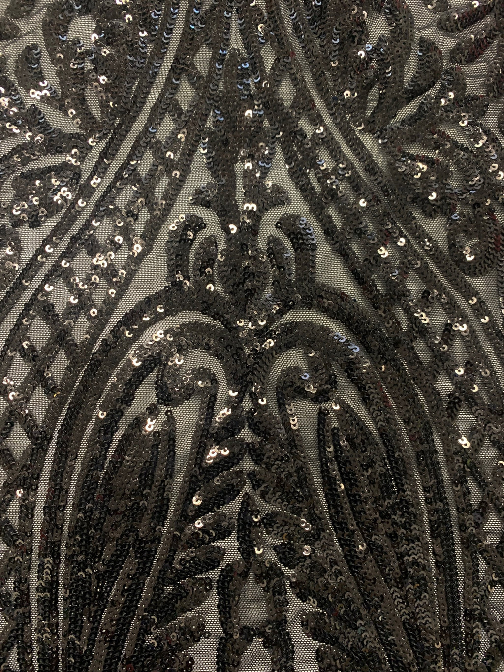 Black All over Sequins fabric color black width 55 inches, fabric has 3 inch salvage (plain mesh) on each side. free sample.