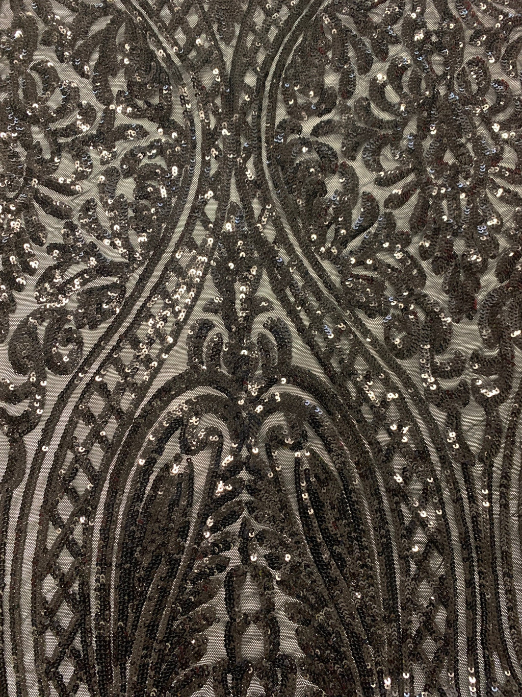 Black All over Sequins fabric color black width 55 inches, fabric has 3 inch salvage (plain mesh) on each side. free sample.