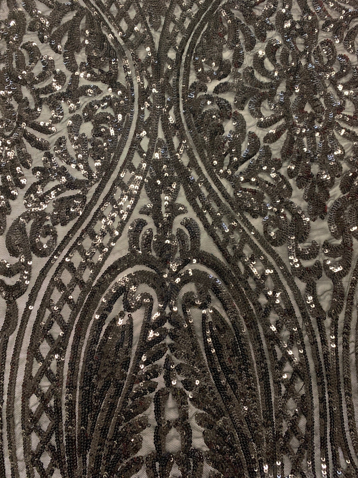 Black All over Sequins fabric color black width 55 inches, fabric has 3 inch salvage (plain mesh) on each side. free sample.