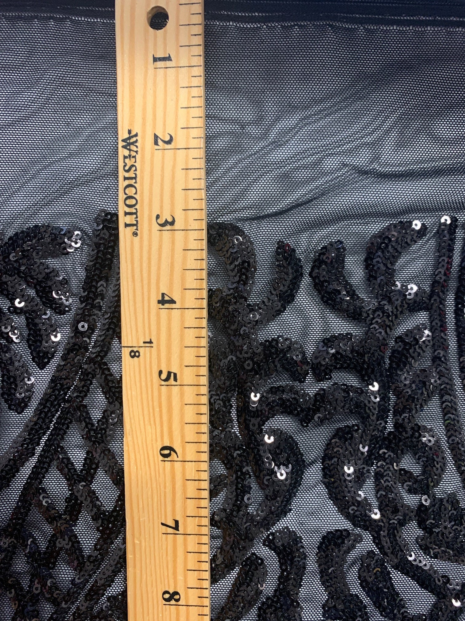 Black All over Sequins fabric color black width 55 inches, fabric has 3 inch salvage (plain mesh) on each side. free sample.