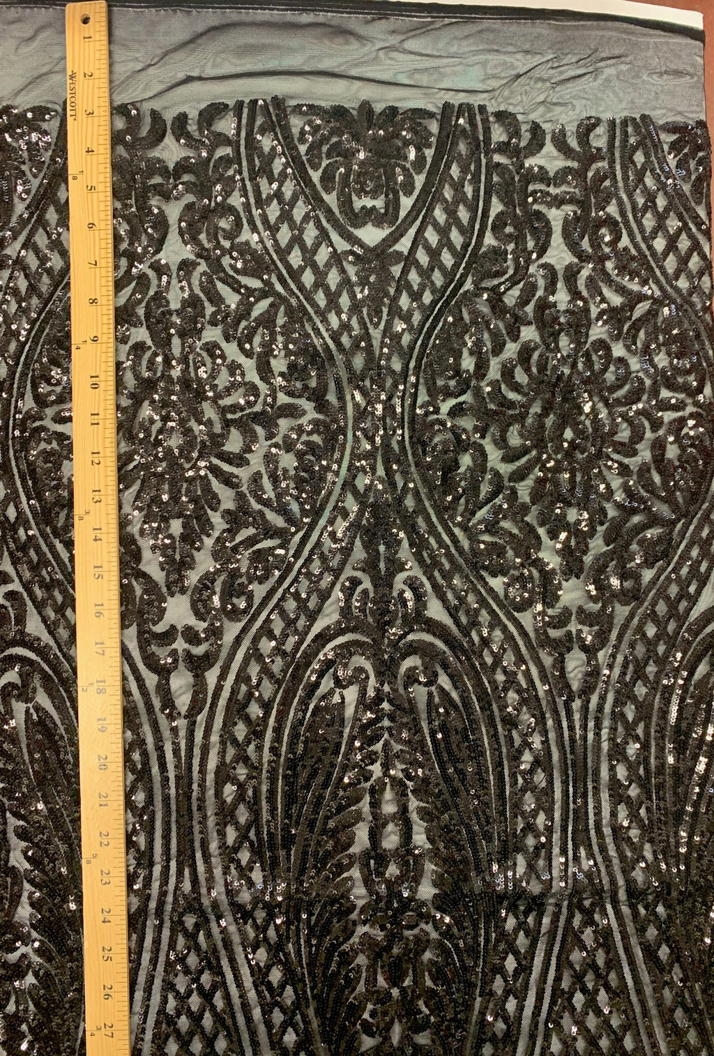 Black All over Sequins fabric color black width 55 inches, fabric has 3 inch salvage (plain mesh) on each side. free sample.