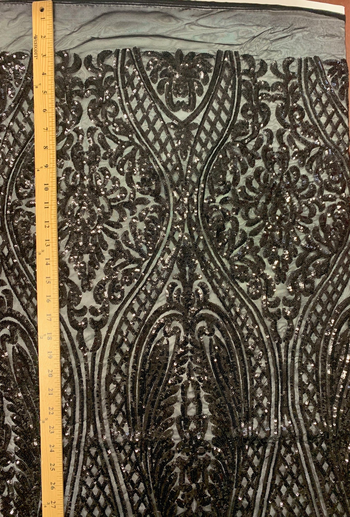 Black All over Sequins fabric color black width 55 inches, fabric has 3 inch salvage (plain mesh) on each side. free sample.