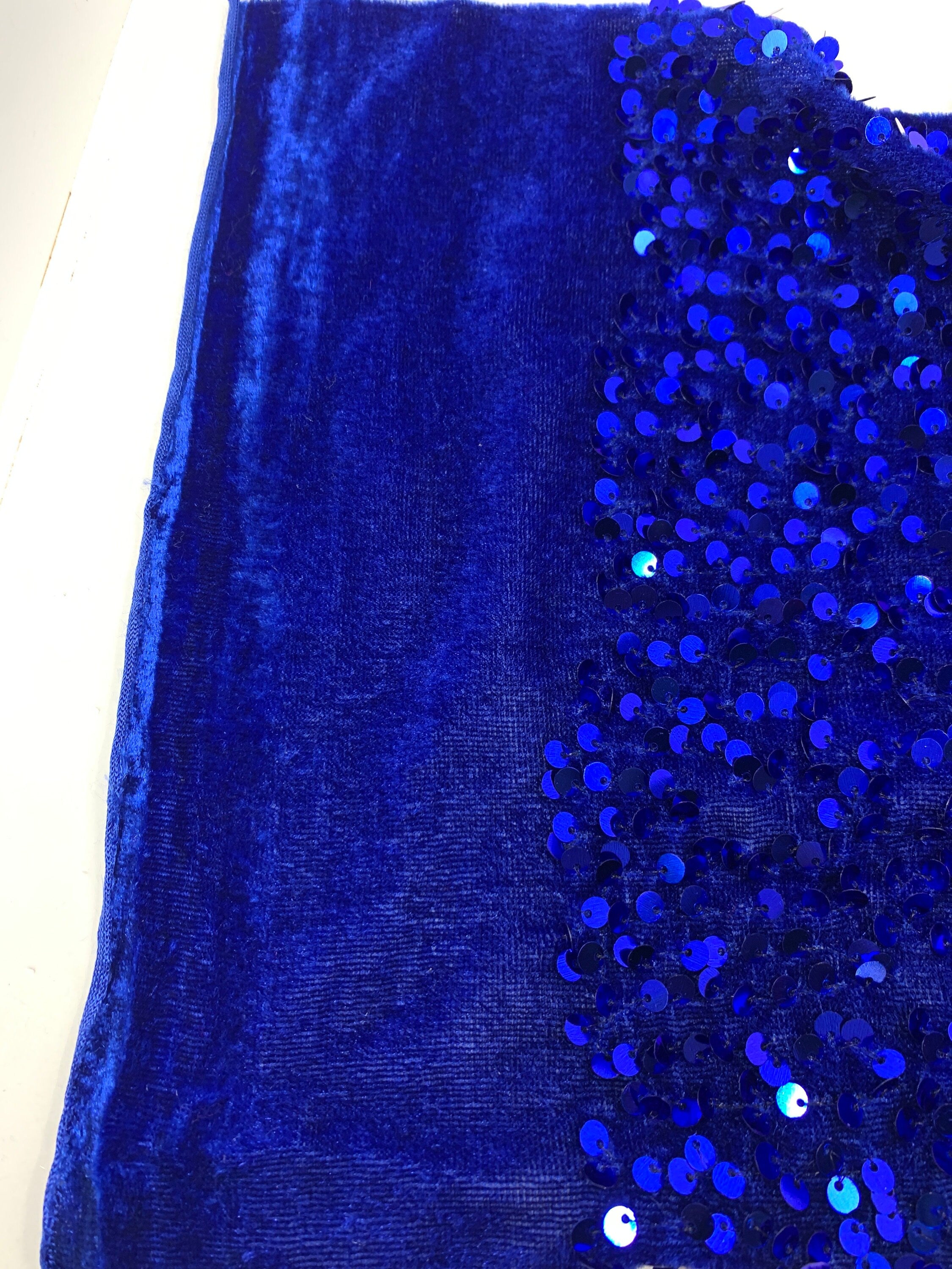 Pane velour sequins fabric. color royal blue, polyester yarn and metallic sewn sequins width is 58/59” with plain salvage of 3” both side