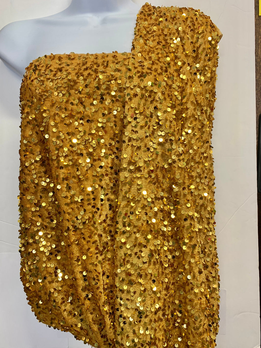 Pane velour sequins fabric, color gold width 59/60" 100% polyester. Sells in 1-yard increments, continuous.