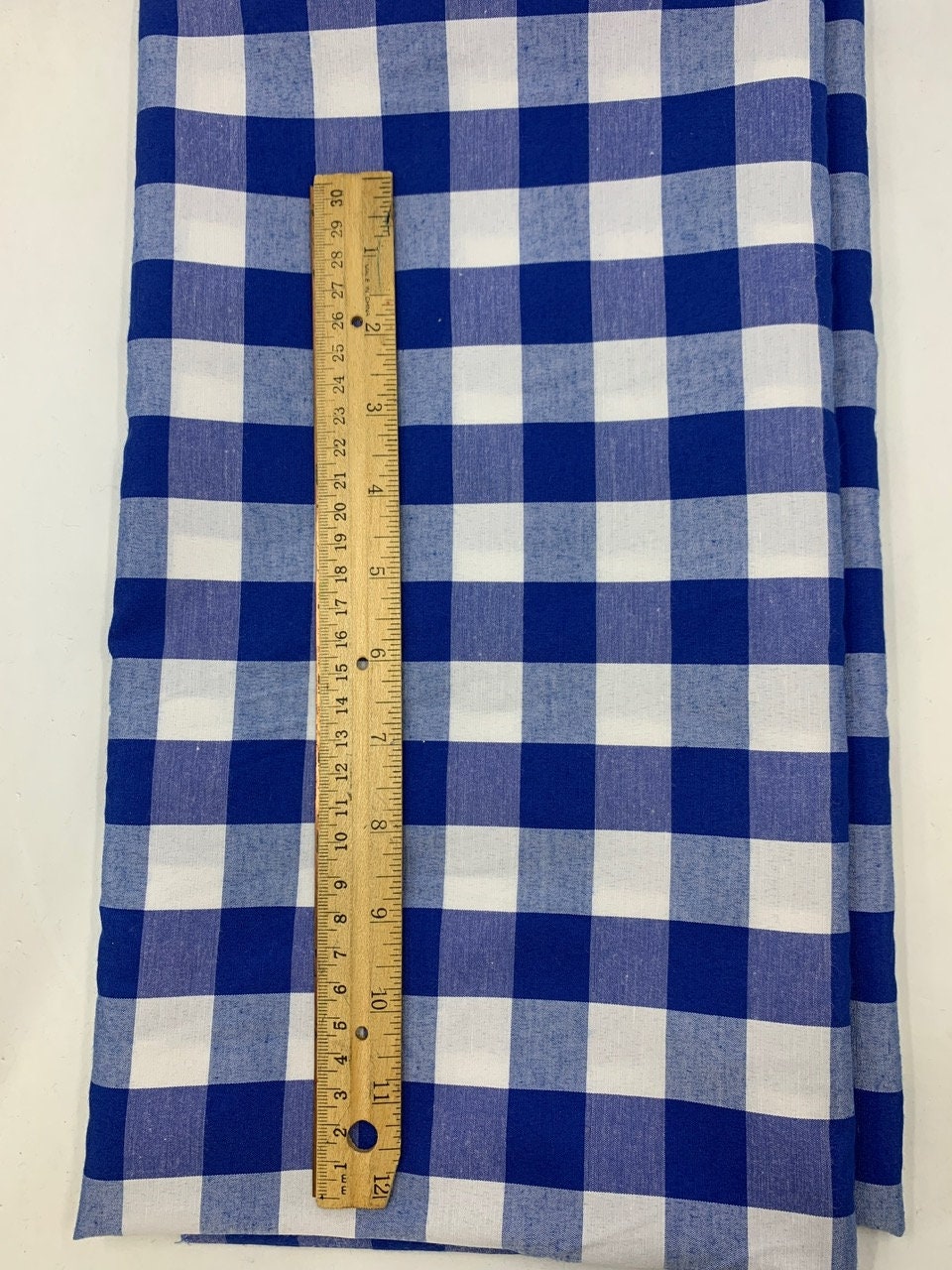 A 3 yards cut Royal blue Gingham fabric. Poly cotton, width 59". 1" square. will cut in 3 yards increment continuous.