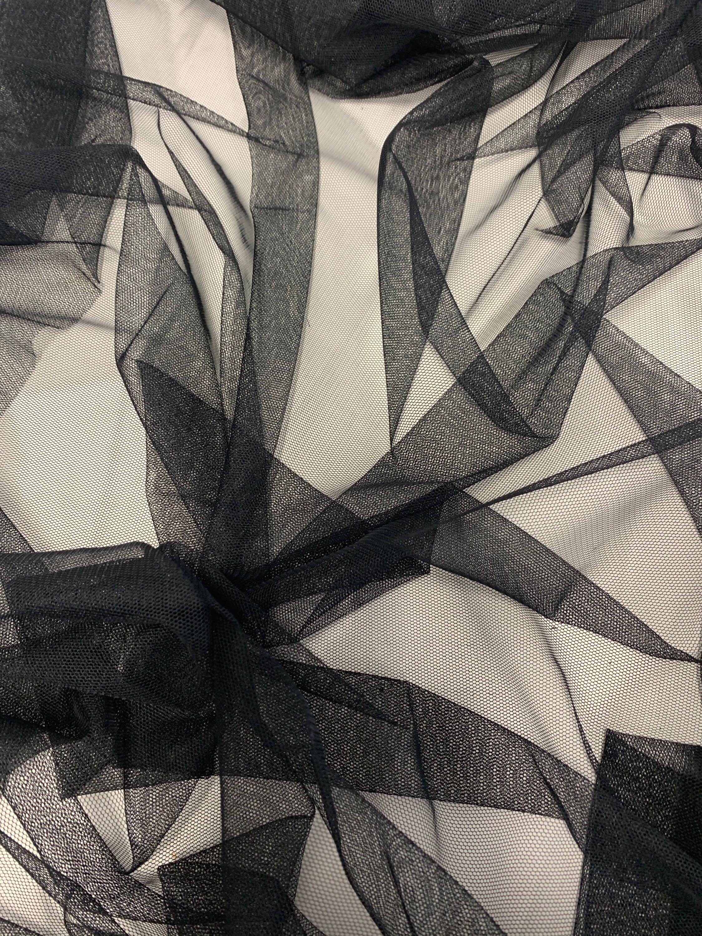 A 2 yards cut Black Mesh Fabric. 100% polyester, width 55 inches. sell by a 2 yards increment continuous.