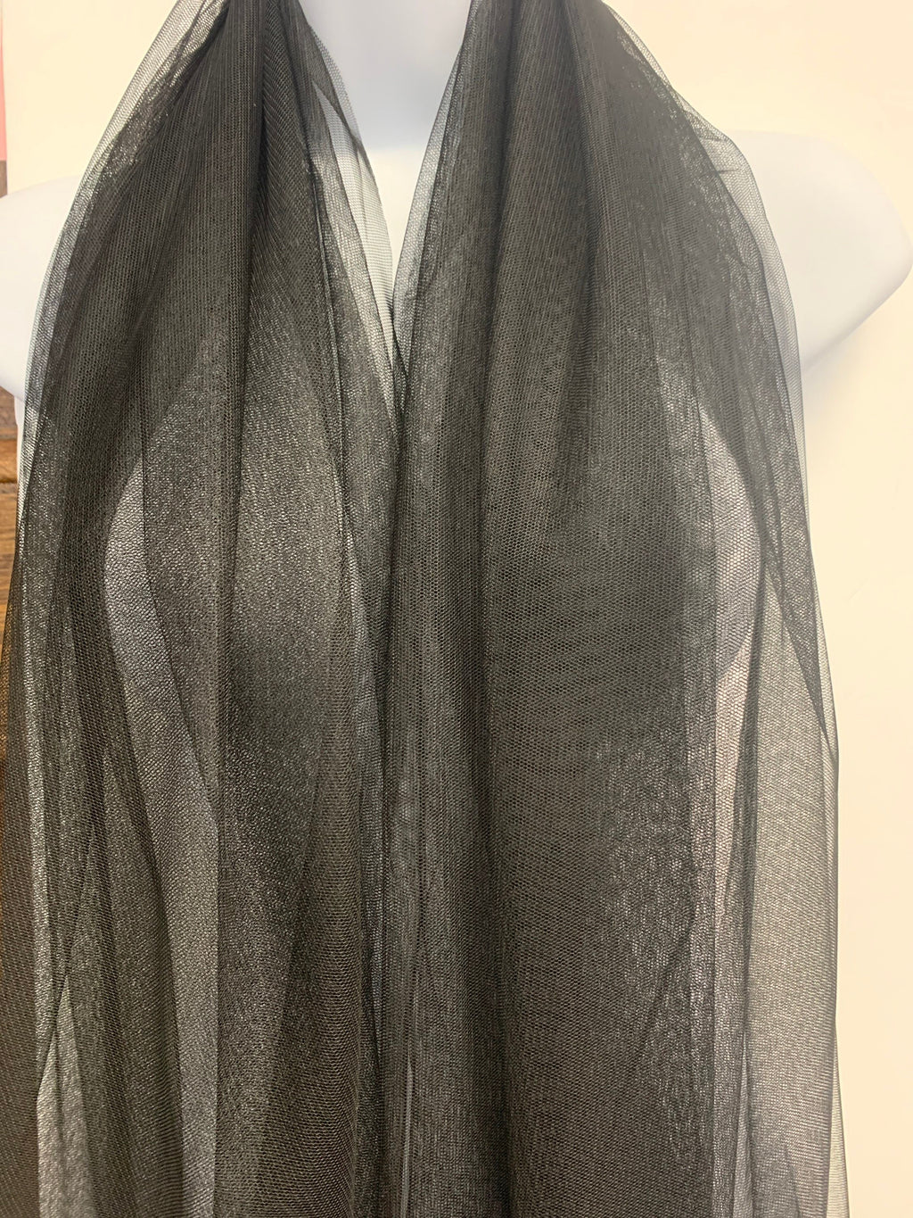 A 2 yards cut Black Mesh Fabric. 100% polyester, width 55 inches. sell by a 2 yards increment continuous.