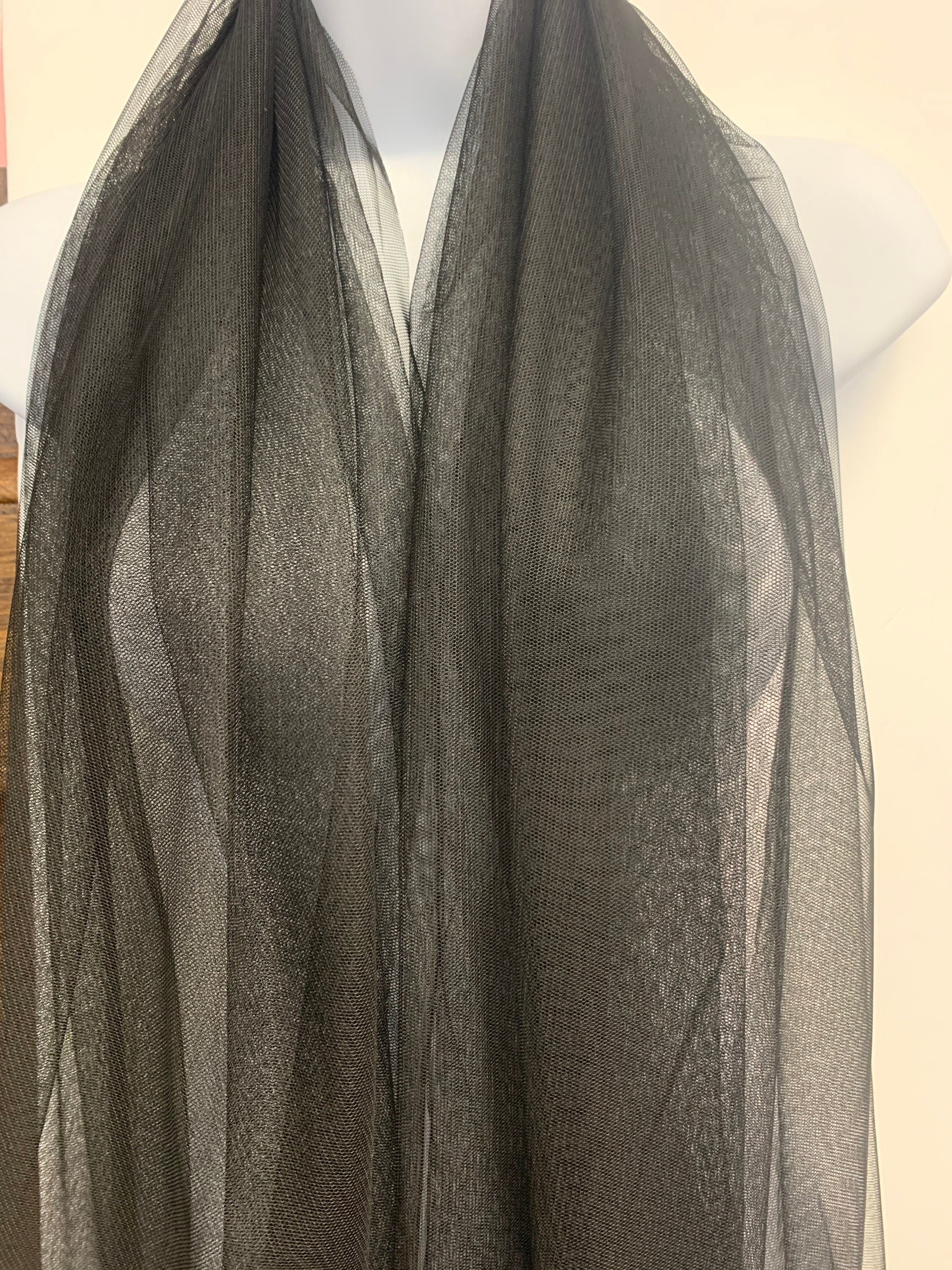 A 2 yards cut Black Mesh Fabric. 100% polyester, width 55 inches. sell by a 2 yards increment continuous.