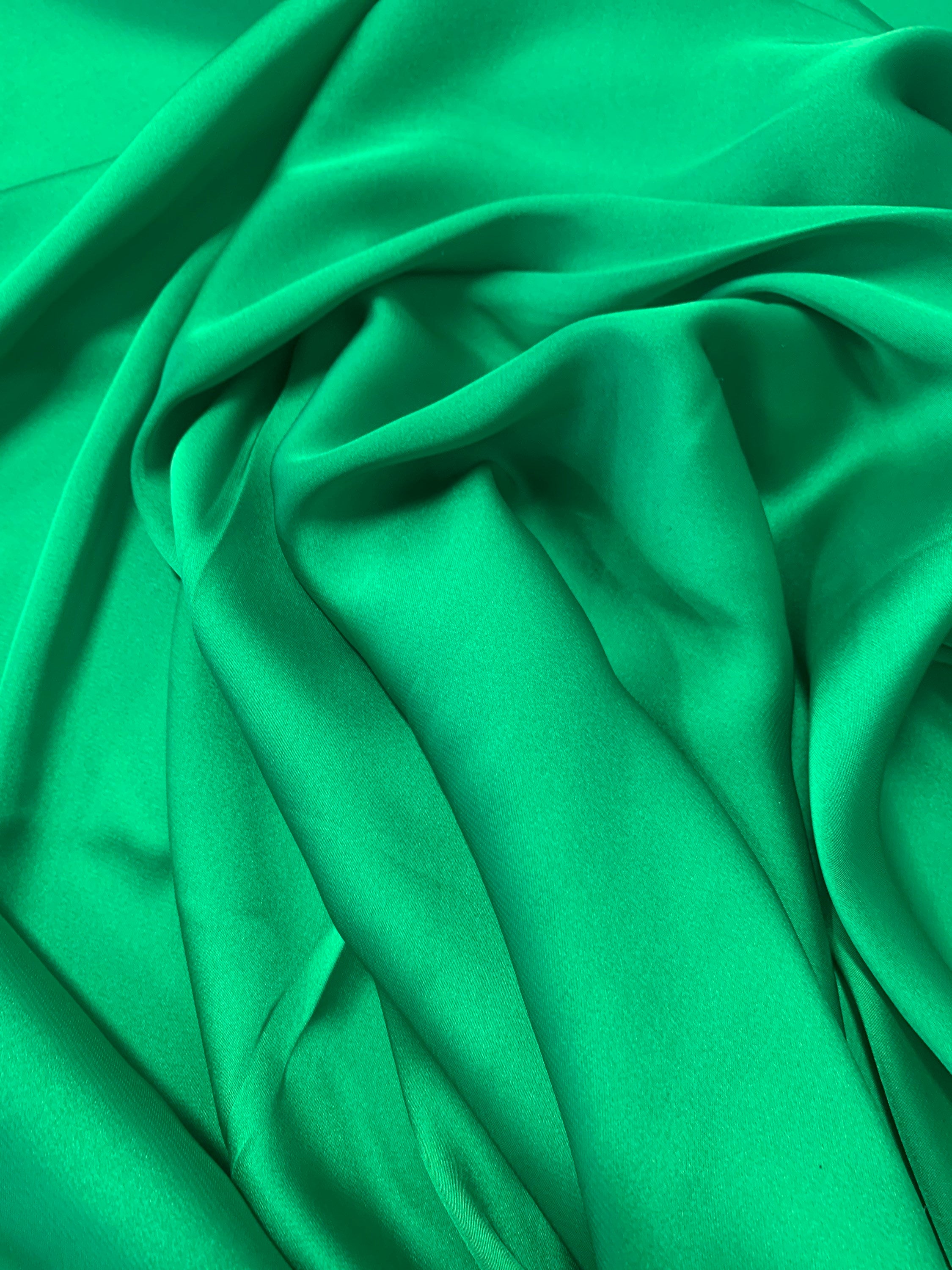 Silky dull soft satin fabric, color Emerald width 59/60 inches 100% polyester. use for blouse, dress and light weight garment and sheer.
