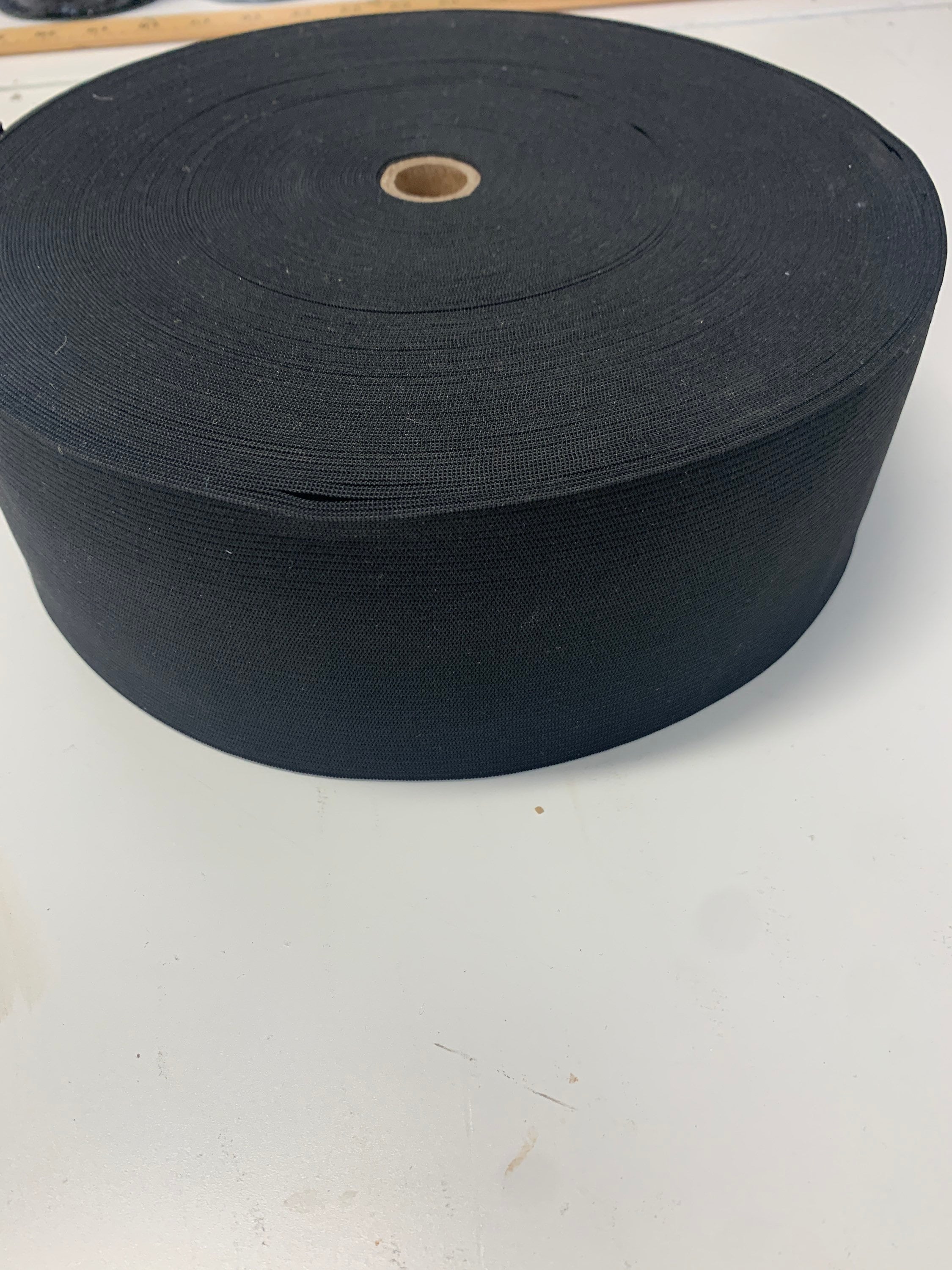 Elastic black 2 1/2 inches wide, 50 yards.