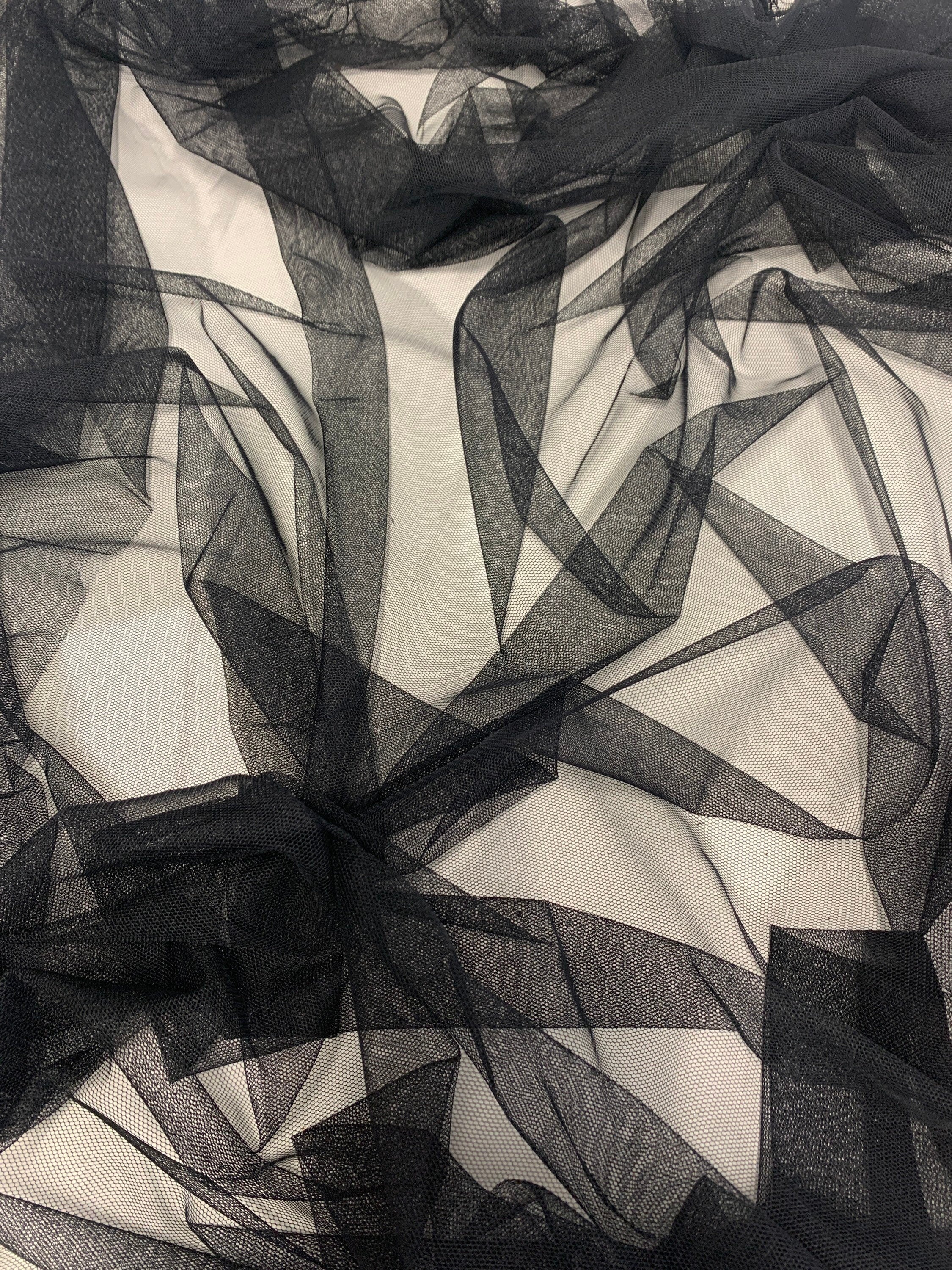 A 2 yards cut Black Mesh Fabric. 100% polyester, width 55 inches. sell by a 2 yards increment continuous.