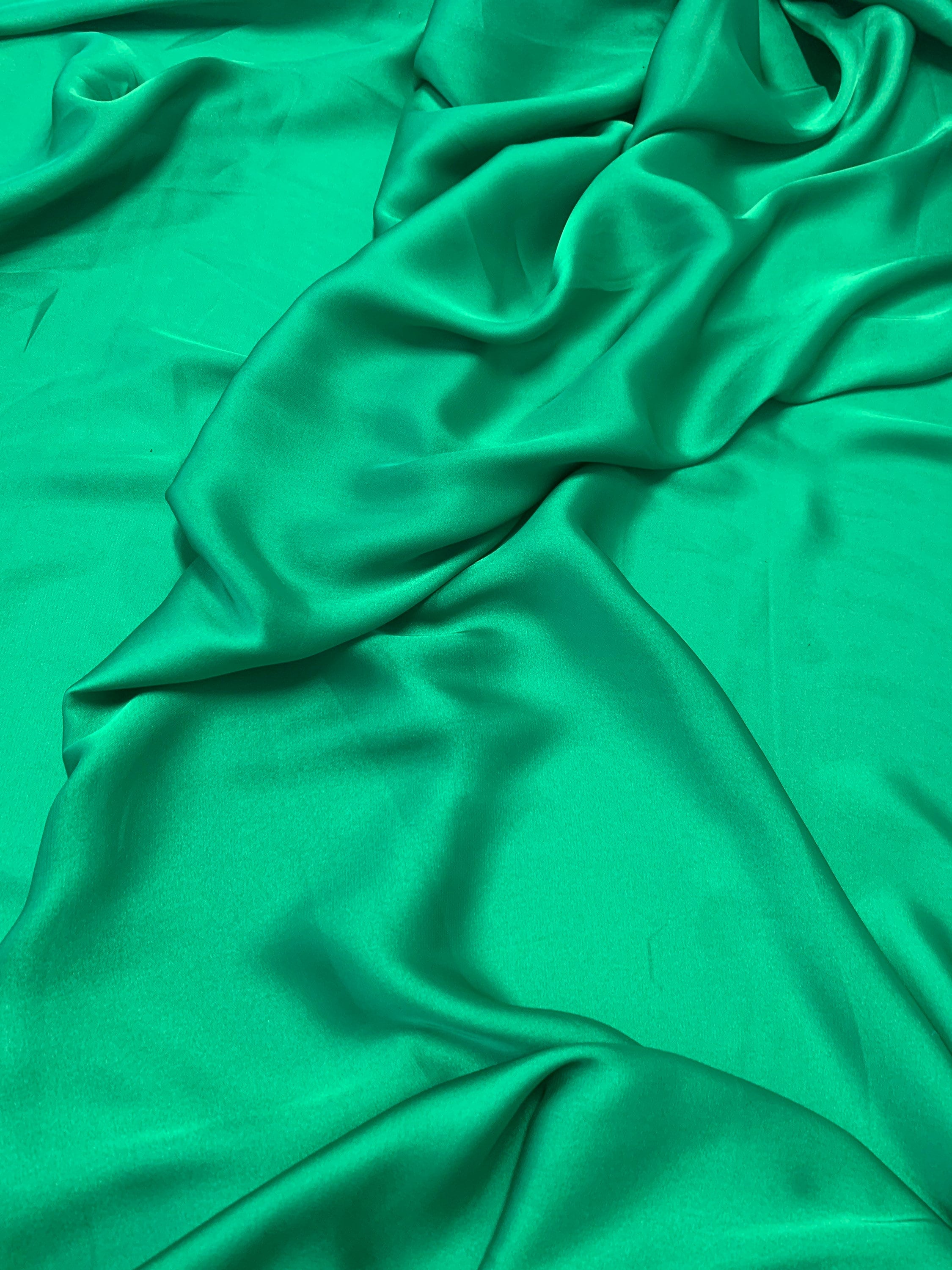 Silky dull soft satin fabric, color Emerald width 59/60 inches 100% polyester. use for blouse, dress and light weight garment and sheer.