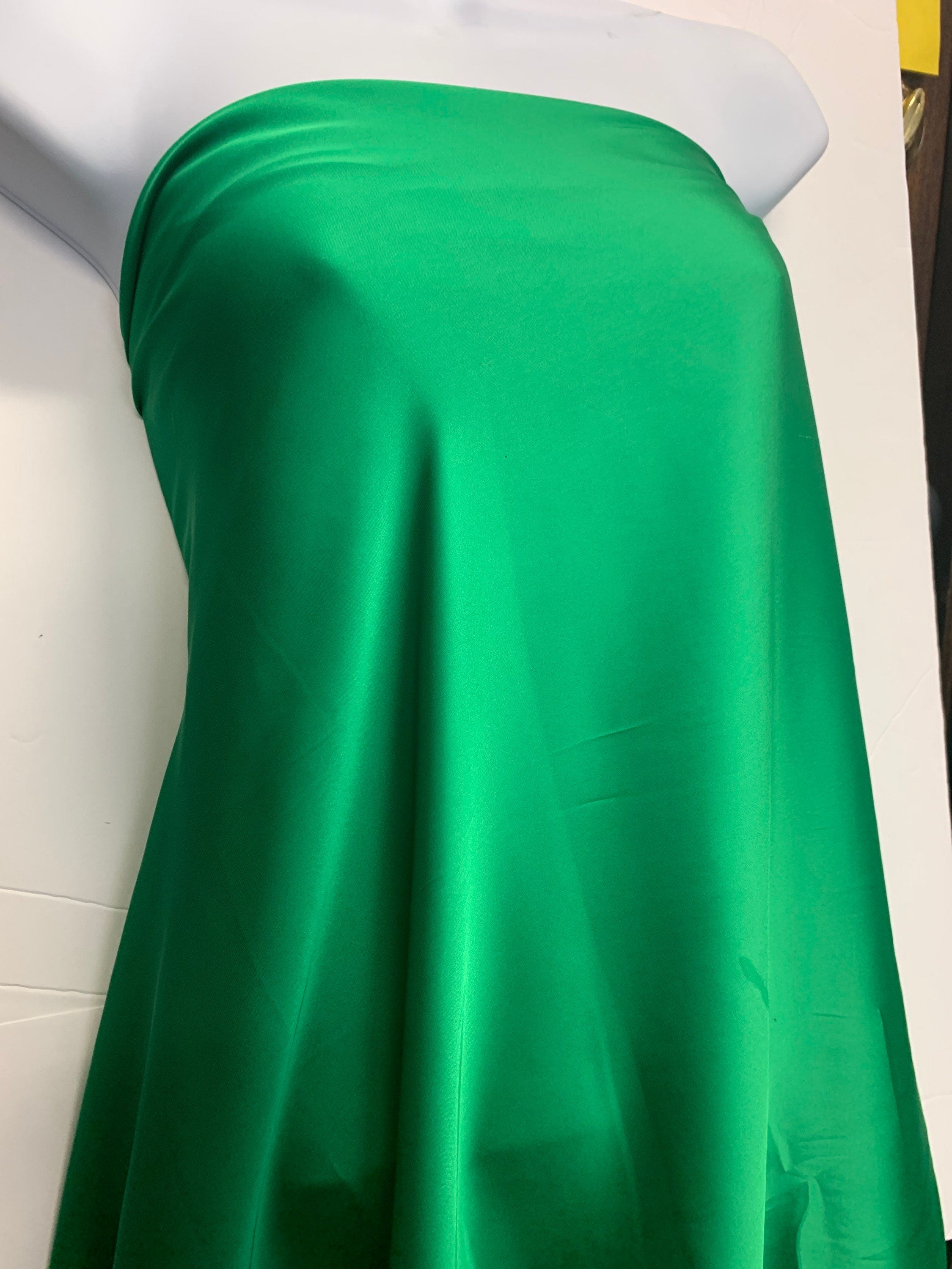 Silky dull soft satin fabric, color Emerald width 59/60 inches 100% polyester. use for blouse, dress and light weight garment and sheer.