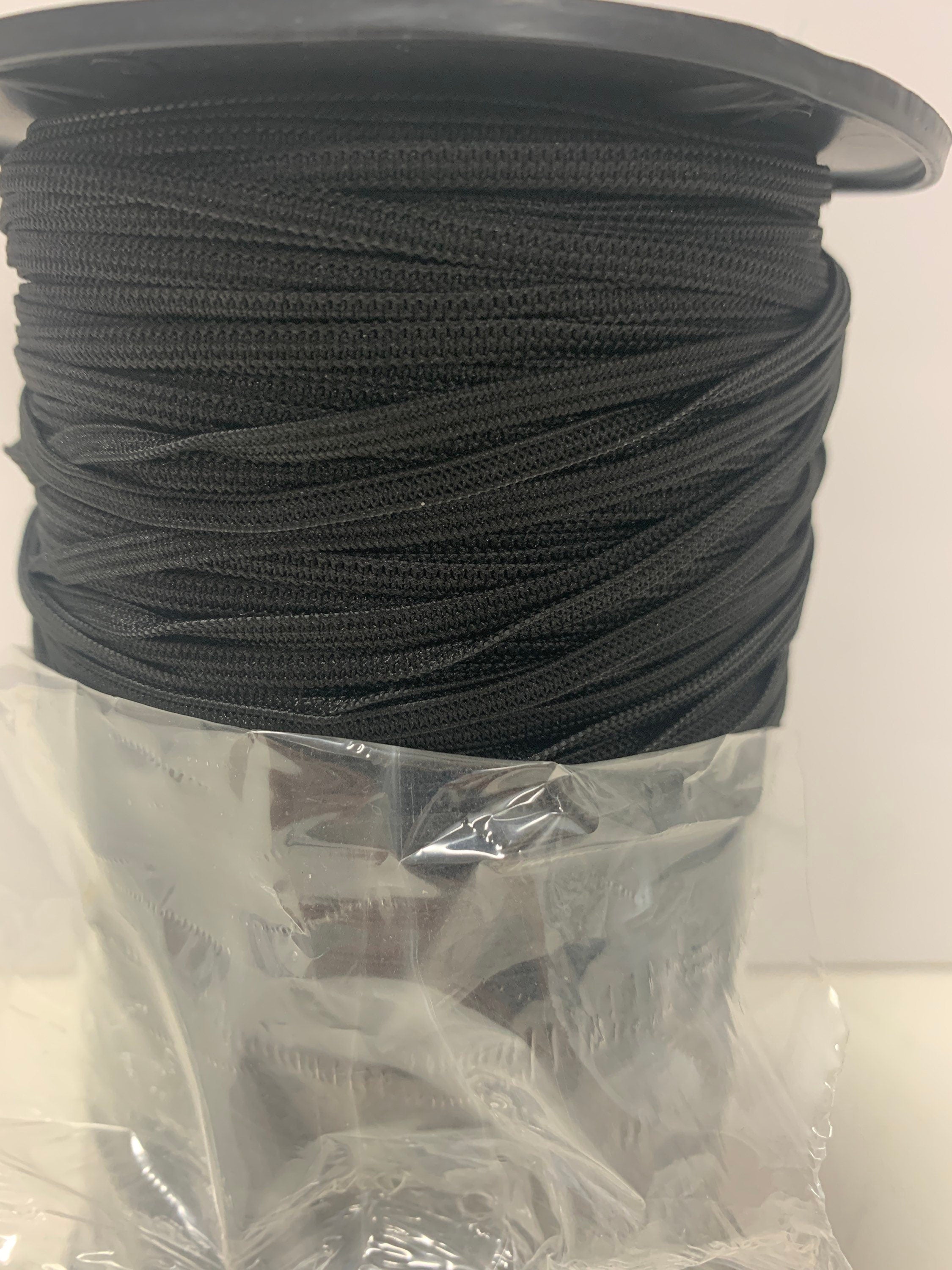 elastic color black width1/8 inch 300 yards per spool. More description , 1/8" Braided elastic string .