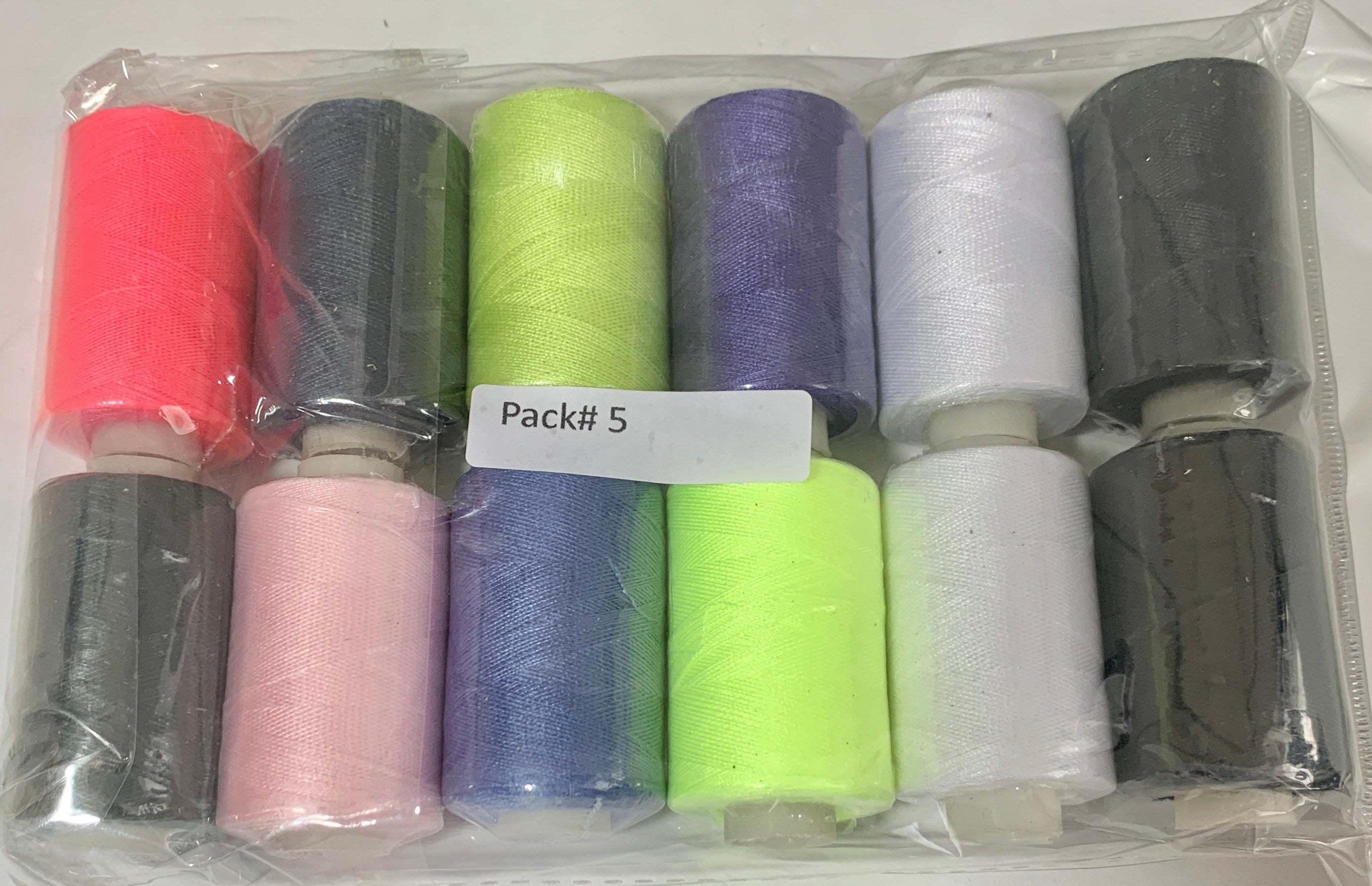 Sewing threads 12 assorted colors per package, each package assortment is different from each other, all packages has 2 black and 2 white.