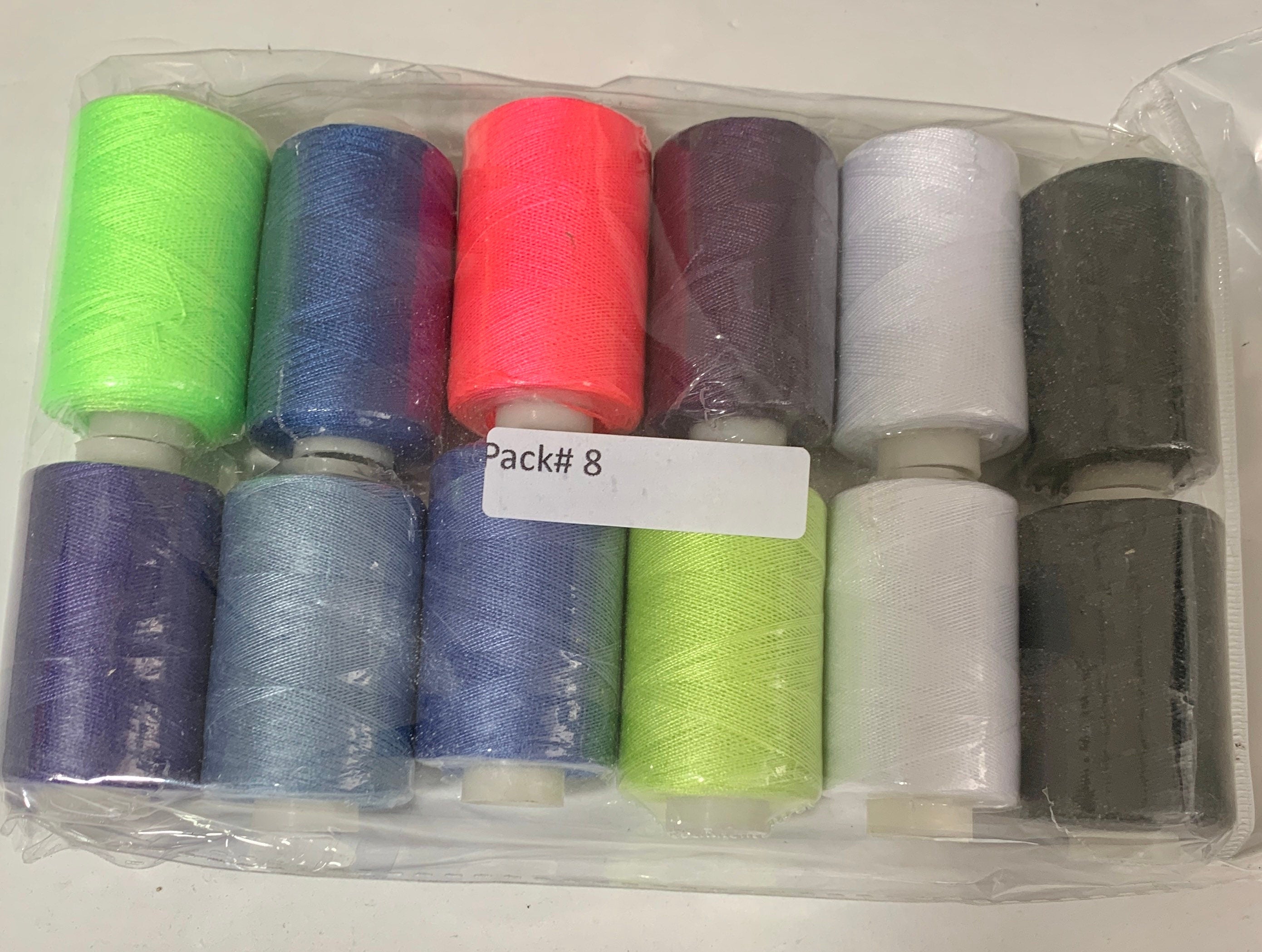 Sewing threads 12 assorted colors per package, each package assortment is different from each other, all packages has 2 black and 2 white.