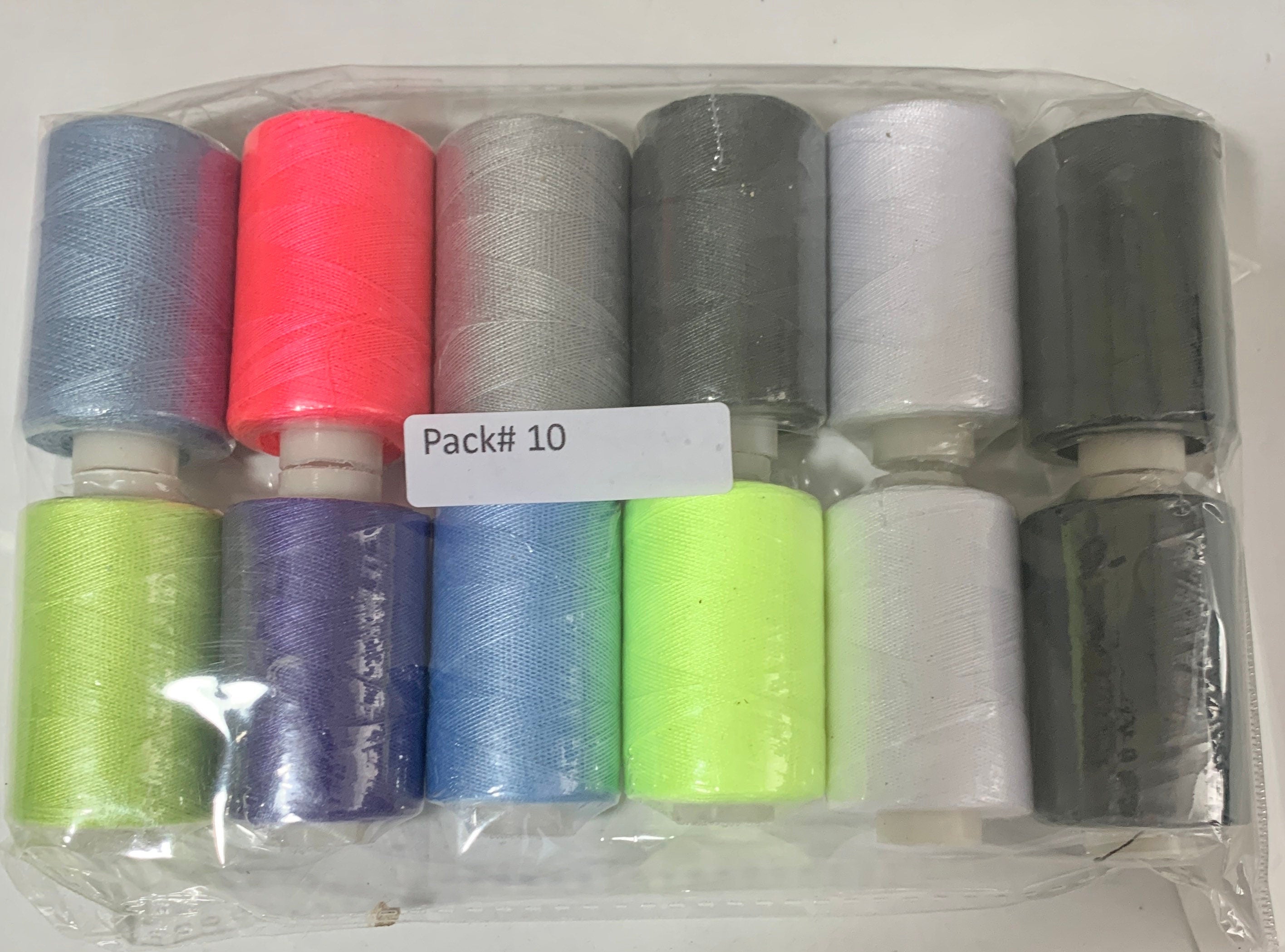 Sewing threads 12 assorted colors per package, each package assortment is different from each other, all packages has 2 black and 2 white.