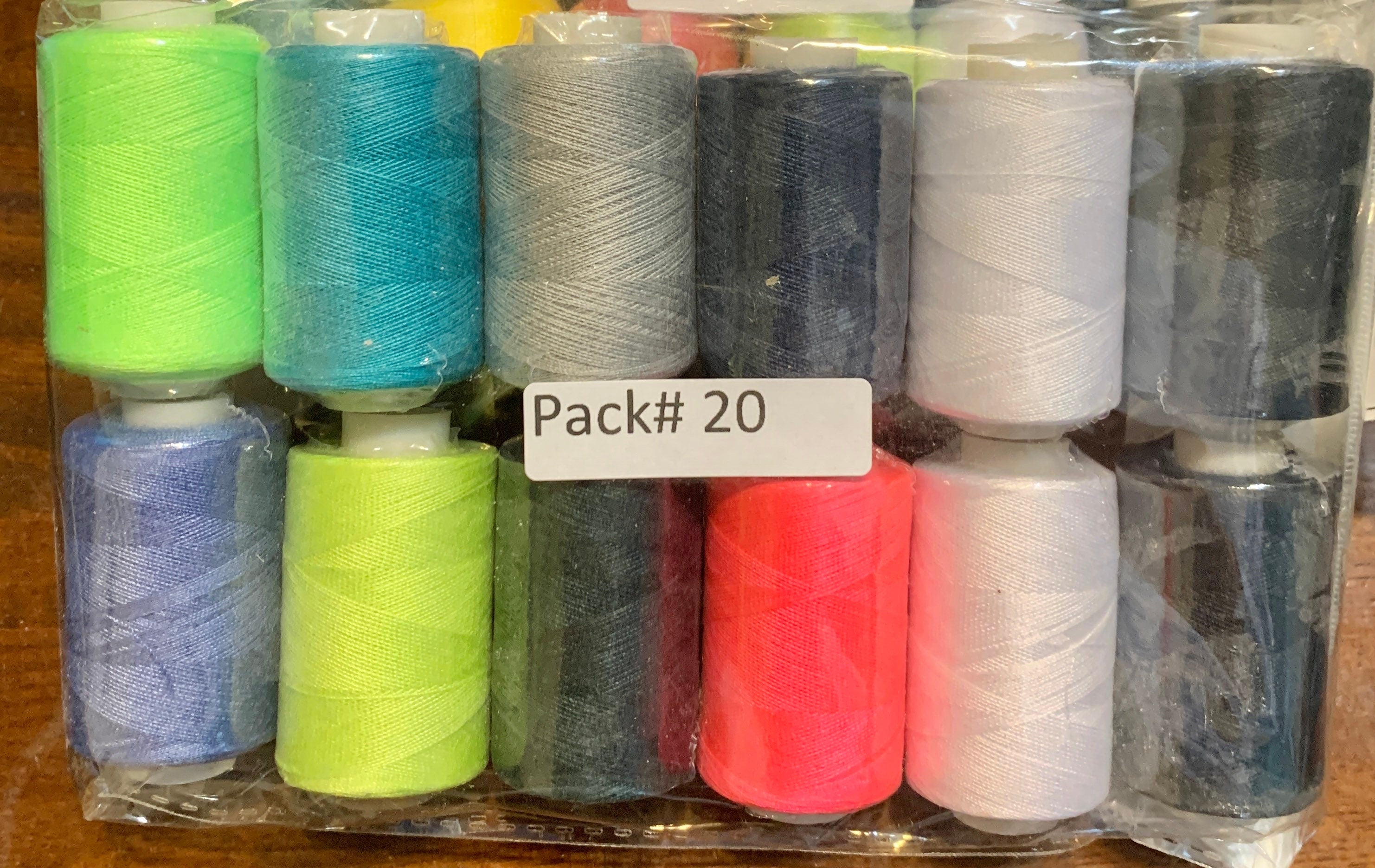 Sewing threads 12 assorted colors per package, each package assortment is different from each other, all packages has 2 black and 2 white.