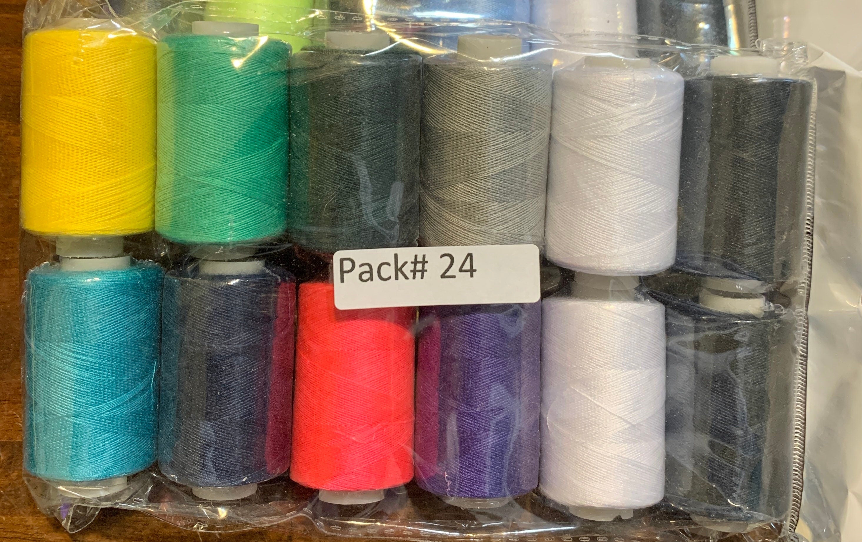 Sewing threads 12 assorted colors per package, each package assortment is different from each other, all packages has 2 black and 2 white.