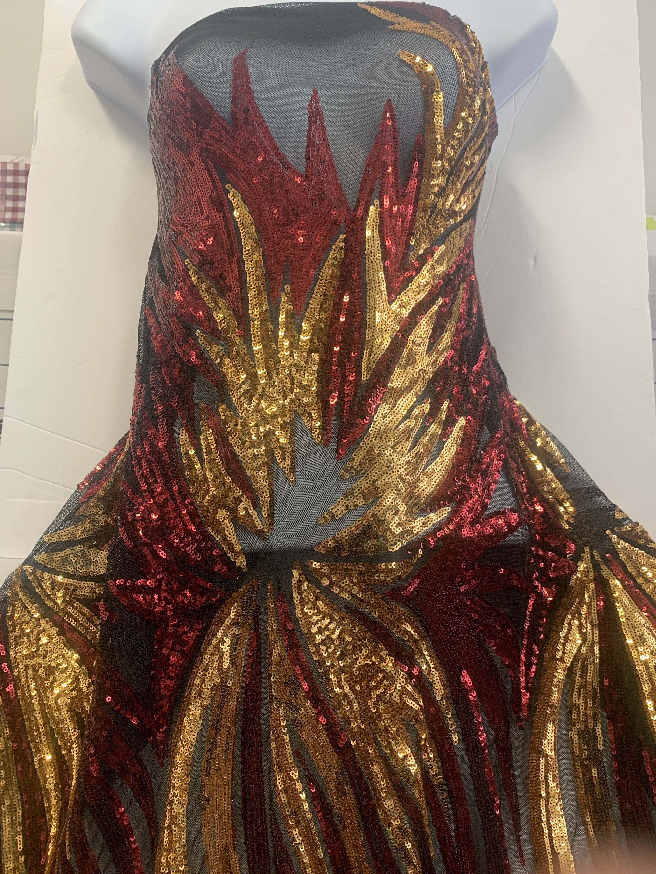All over Sequins fabric design Princess color gold/burgundy, width 50 inches.