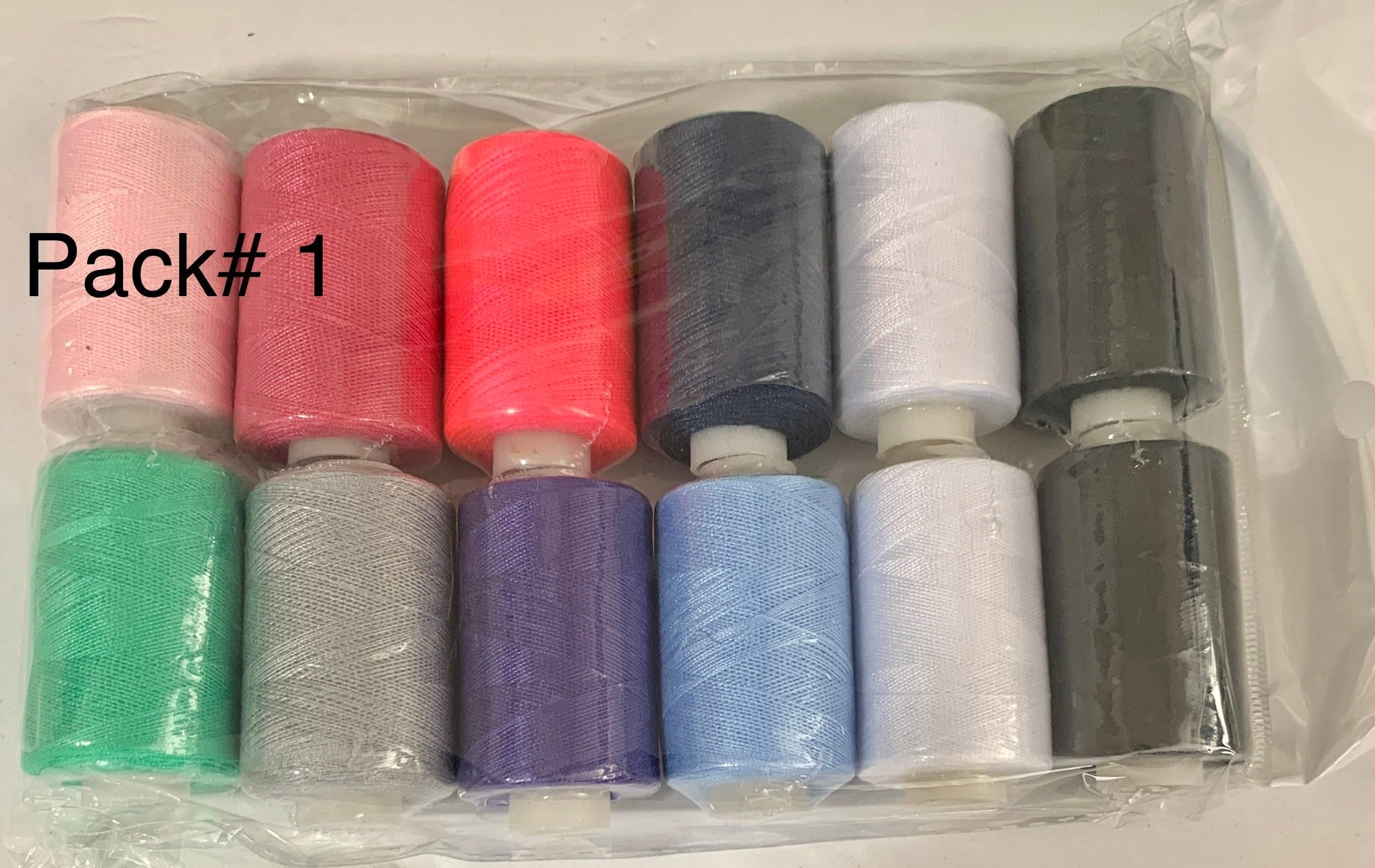 Sewing threads 12 assorted colors per package, each package assortment is different from each other, all packages has 2 black and 2 white.