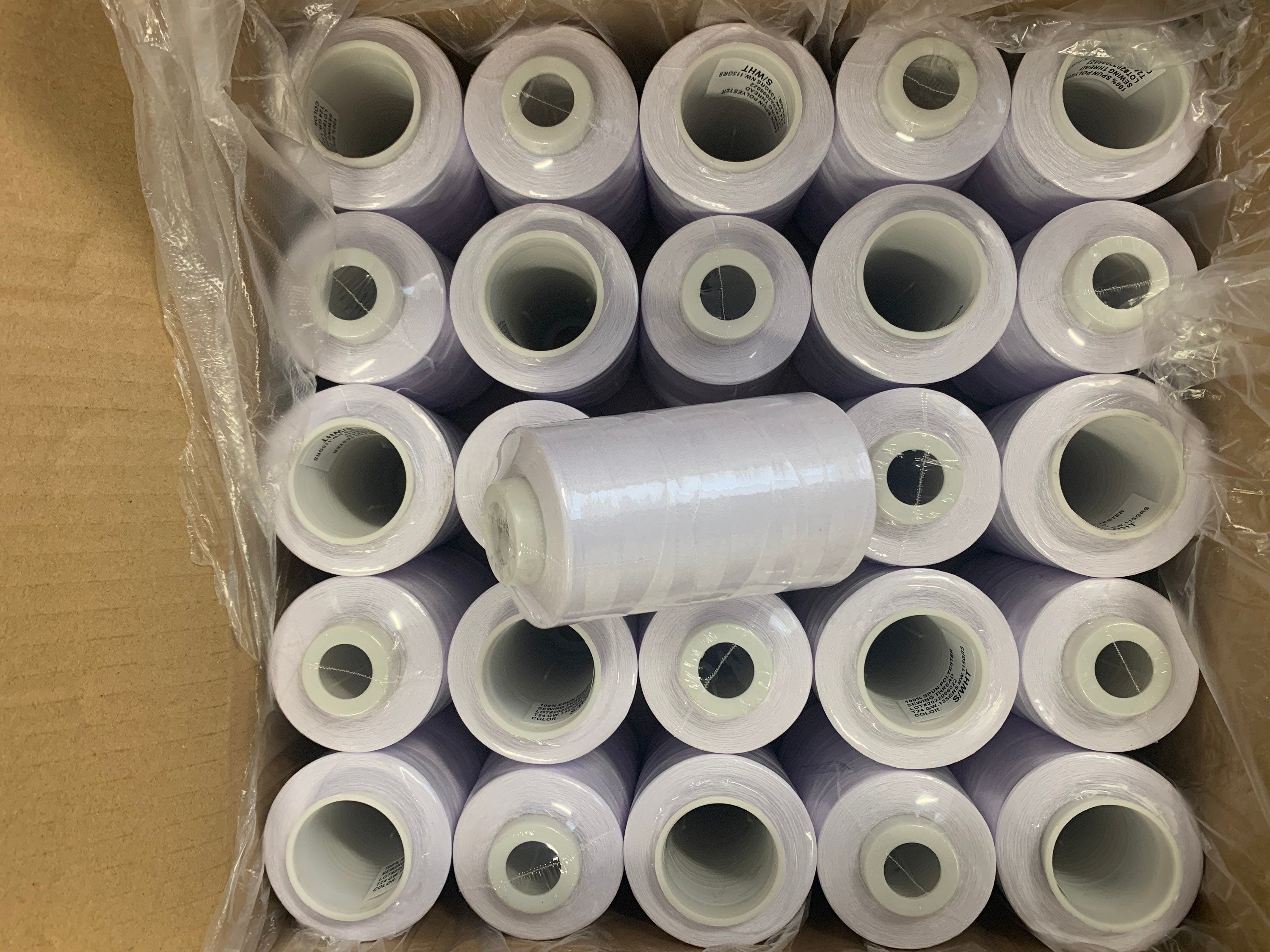 White sewing threads, polyester 130 gram per cone, 3500 yards per cone, wrap in clear cover for daily sewing. thread size 24T