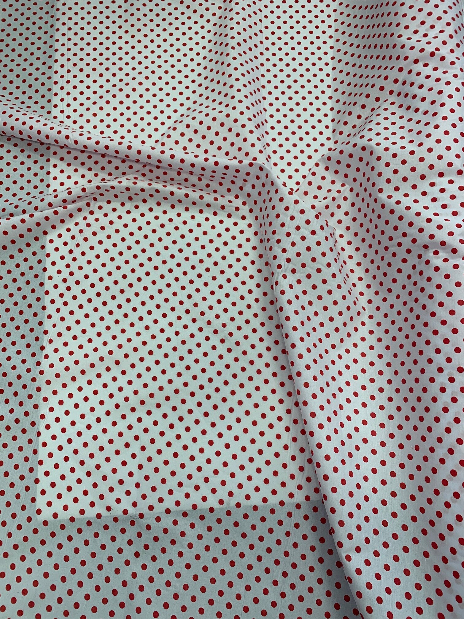 Polk dot fabric, width 57/58 inches, dot size is1/4 inch, 100% polyester broadcloth fabric, shirt weight. Available in 2 colors.