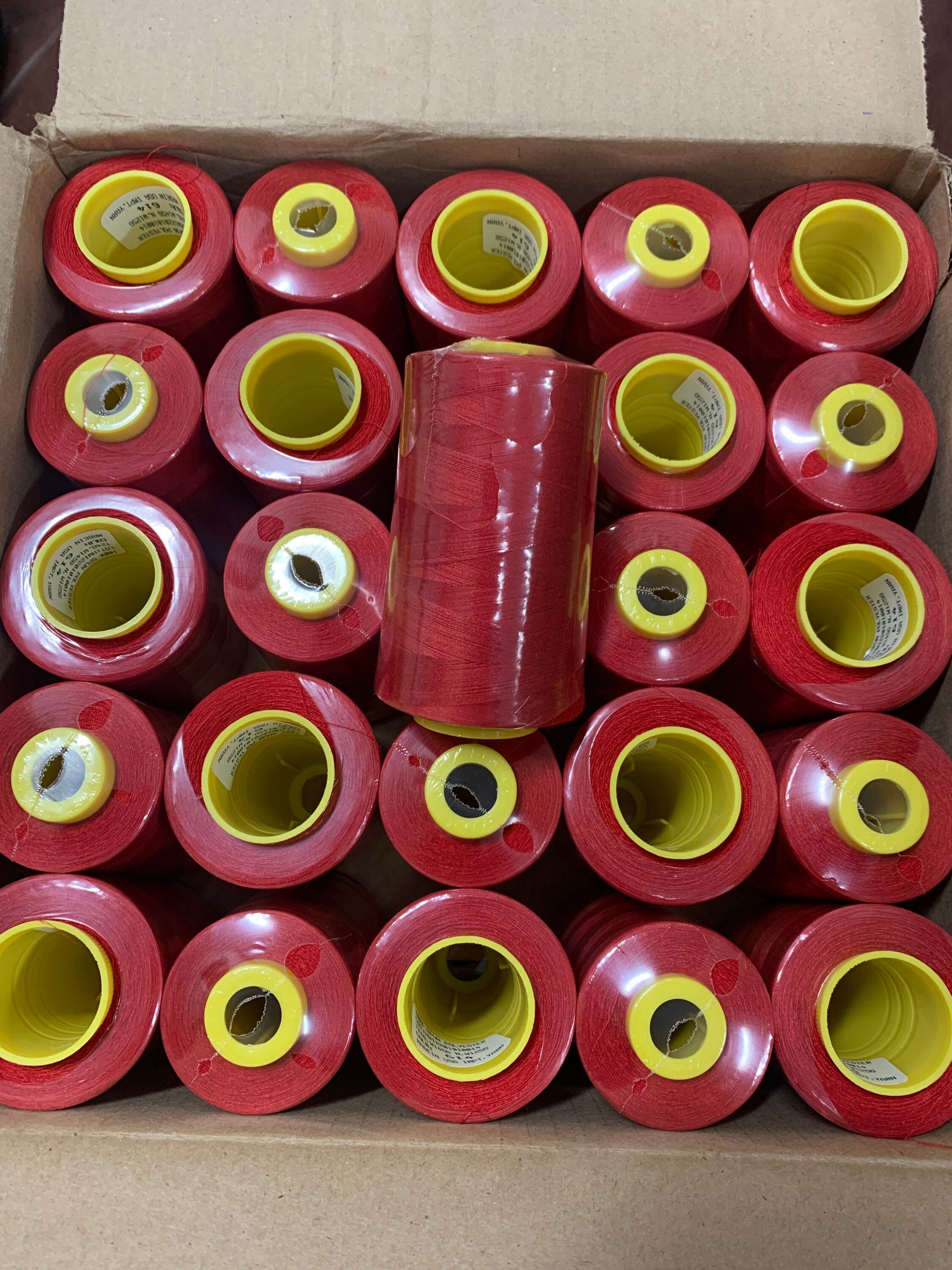 Red sewing threads, polyester 130 gram per cone, 5000 yards per cone, wrap in clear cover for daily sewing. thread size 24T.
