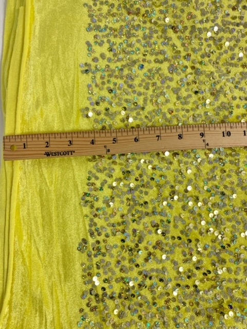 The Pane Velour with Sequins fabric. pane is a 58/60" wide textile made of 100% polyester. It features a soft texture with embedded sequins