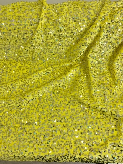 The Pane Velour with Sequins fabric. pane is a 58/60" wide textile made of 100% polyester. It features a soft texture with embedded sequins