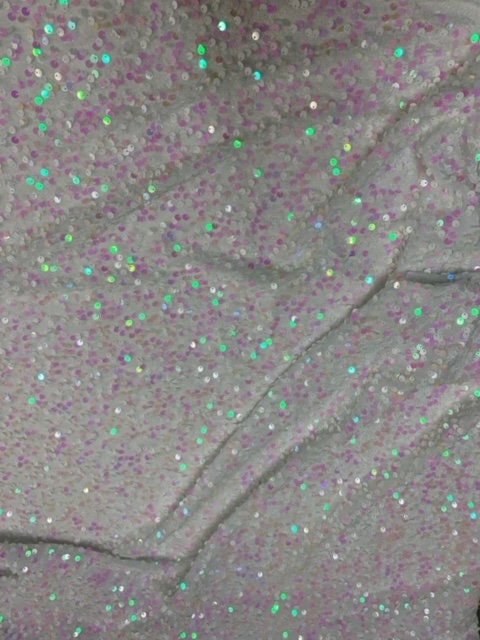 The Pane Velour with Sequins fabric. pane is a 58/60" wide textile made of 100% polyester. It features a soft texture with embedded sequins