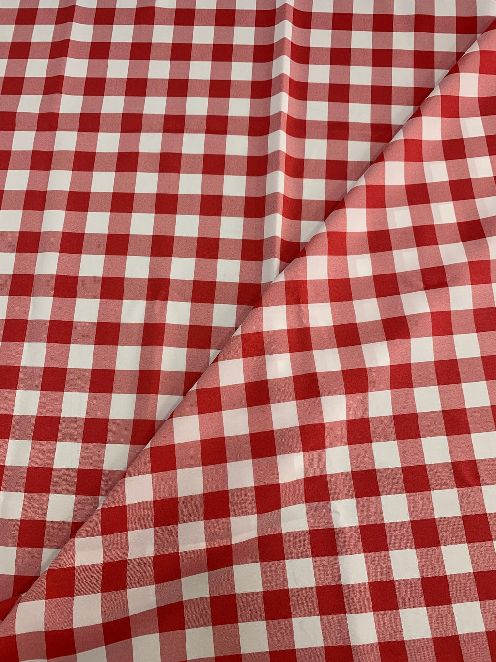 Red /White Poplin (checker) 1" inch squarePolyester fabric, great item for customs, decorations and more. 58 inches wide. sell by yard.