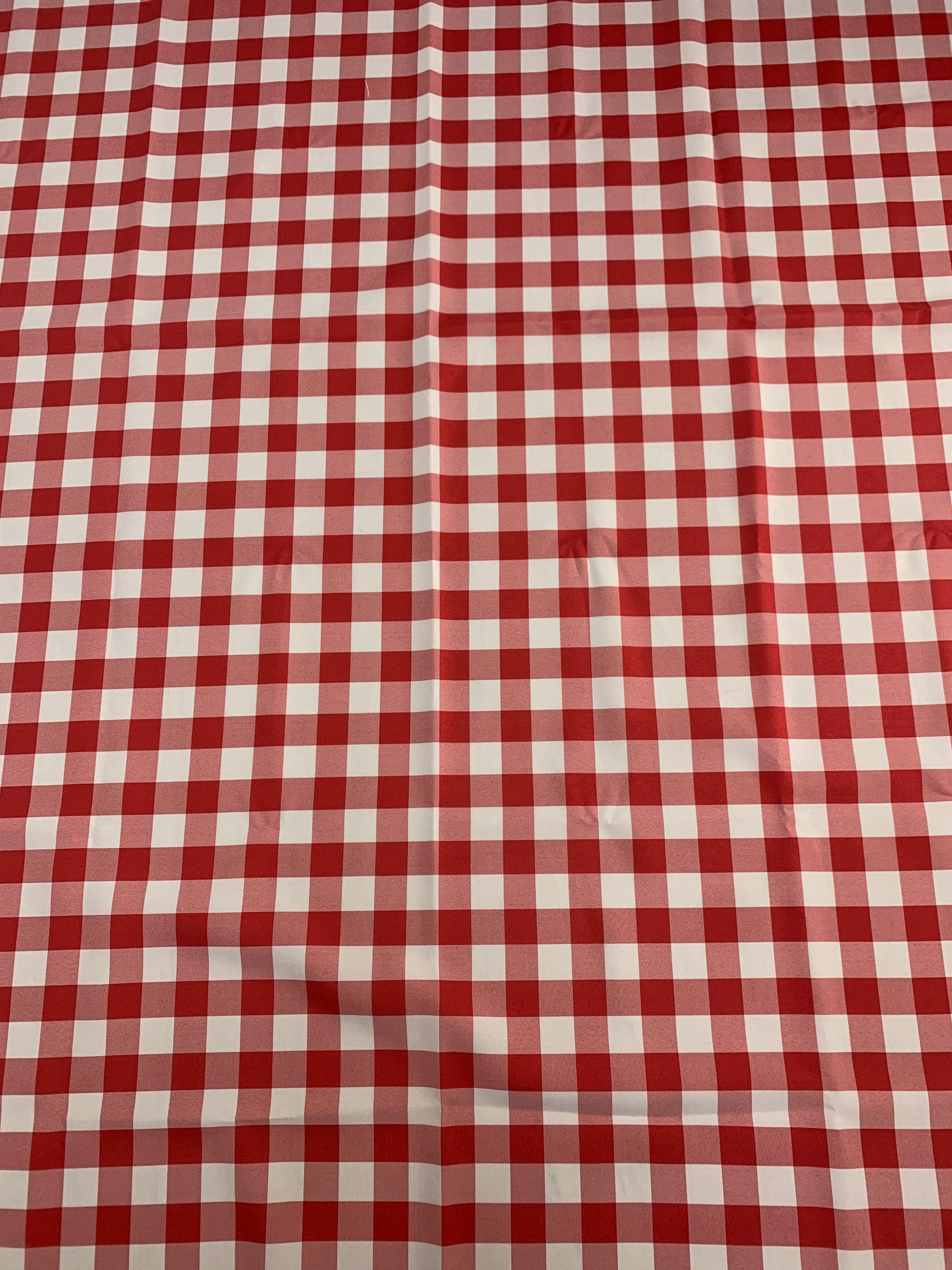 Red /White Poplin (checker) 1" inch squarePolyester fabric, great item for customs, decorations and more. 58 inches wide. sell by yard.