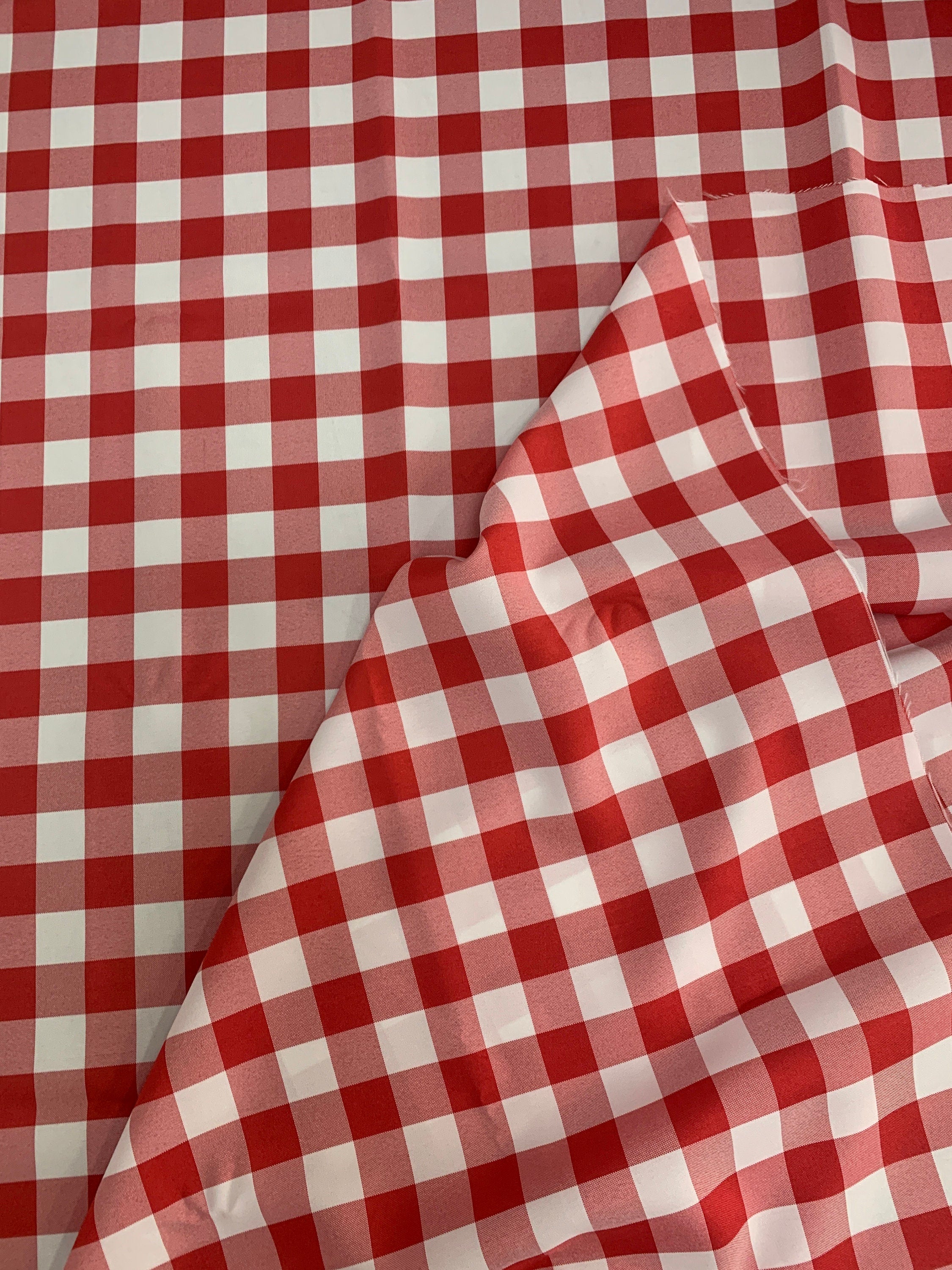 Red /White Poplin (checker) 1" inch squarePolyester fabric, great item for customs, decorations and more. 58 inches wide. sell by yard.