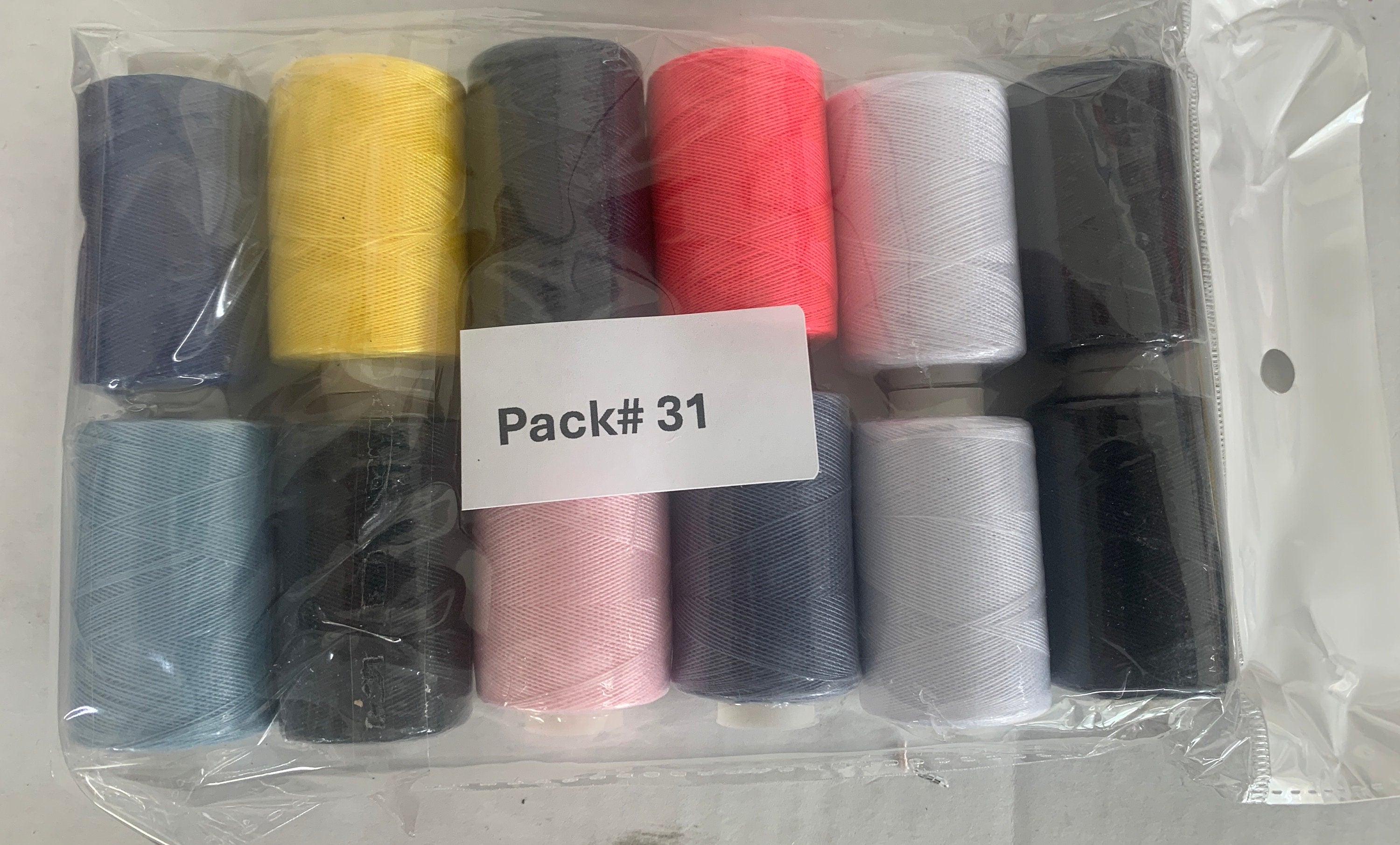 Sewing threads 12 assorted colors per package, each package assortment is different from each other, all packages has 2 black and 2 white.