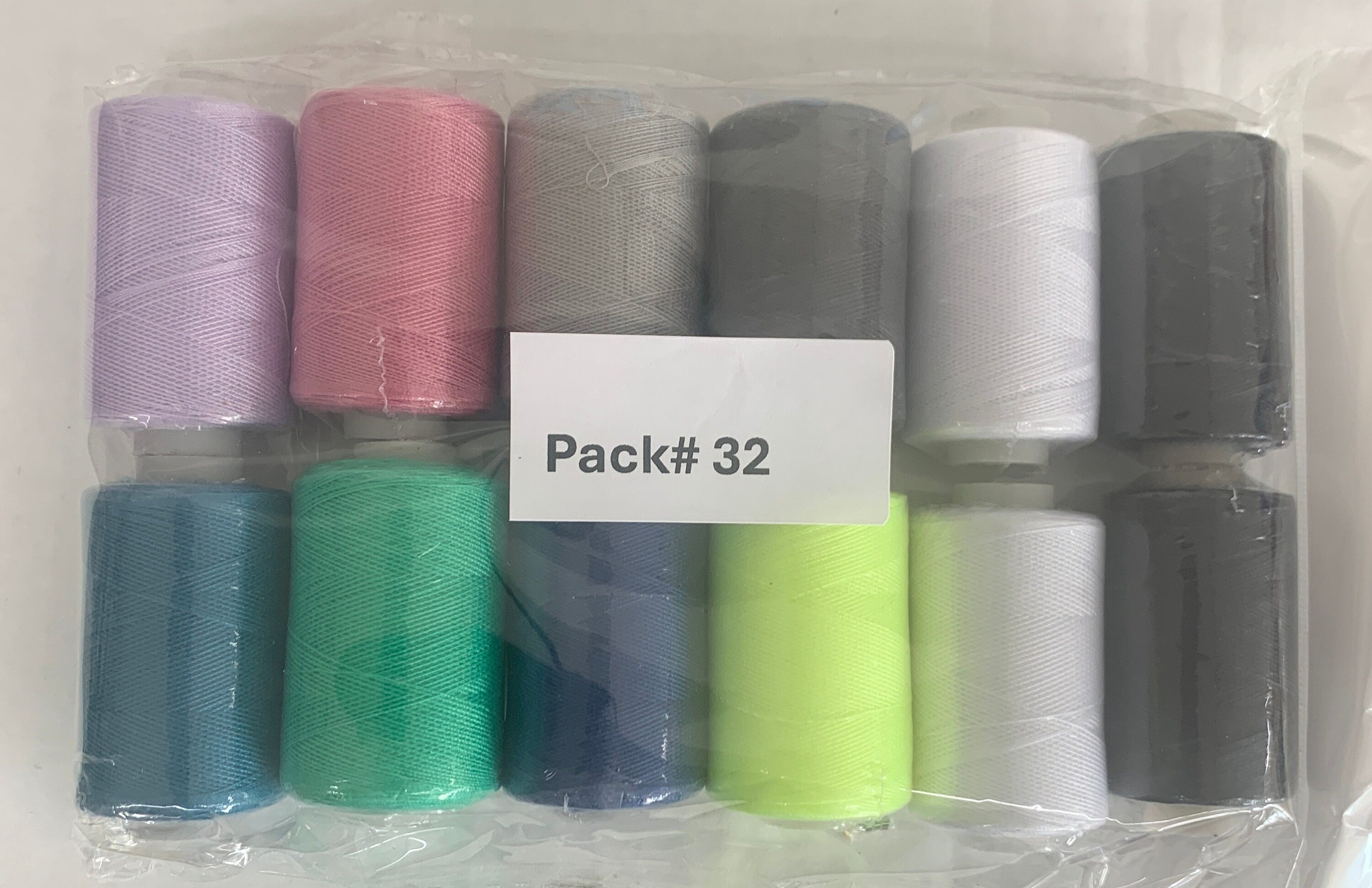 Sewing threads 12 assorted colors per package, each package assortment is different from each other, all packages has 2 black and 2 white.