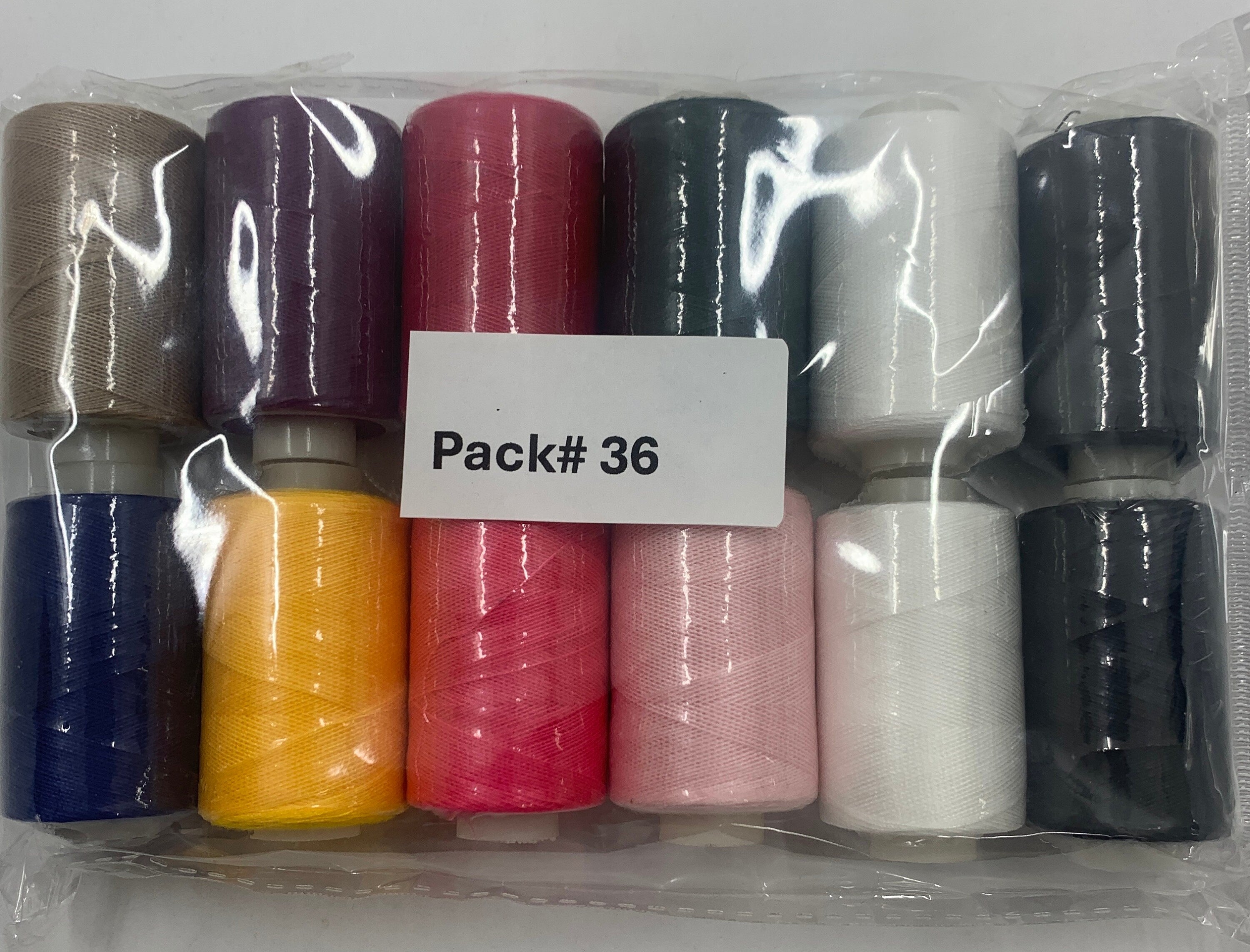 Sewing threads 12 assorted colors per package, each package assortment is different from each other, all packages has 2 black and 2 white.