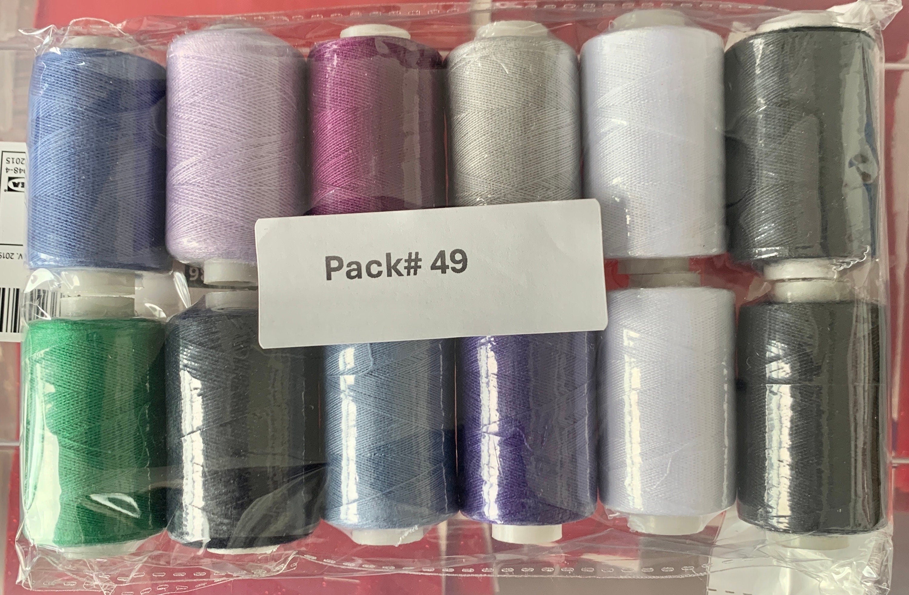 Sewing threads 12 assorted colors per package, each package assortment is different from each other, all packages has 2 black and 2 white.