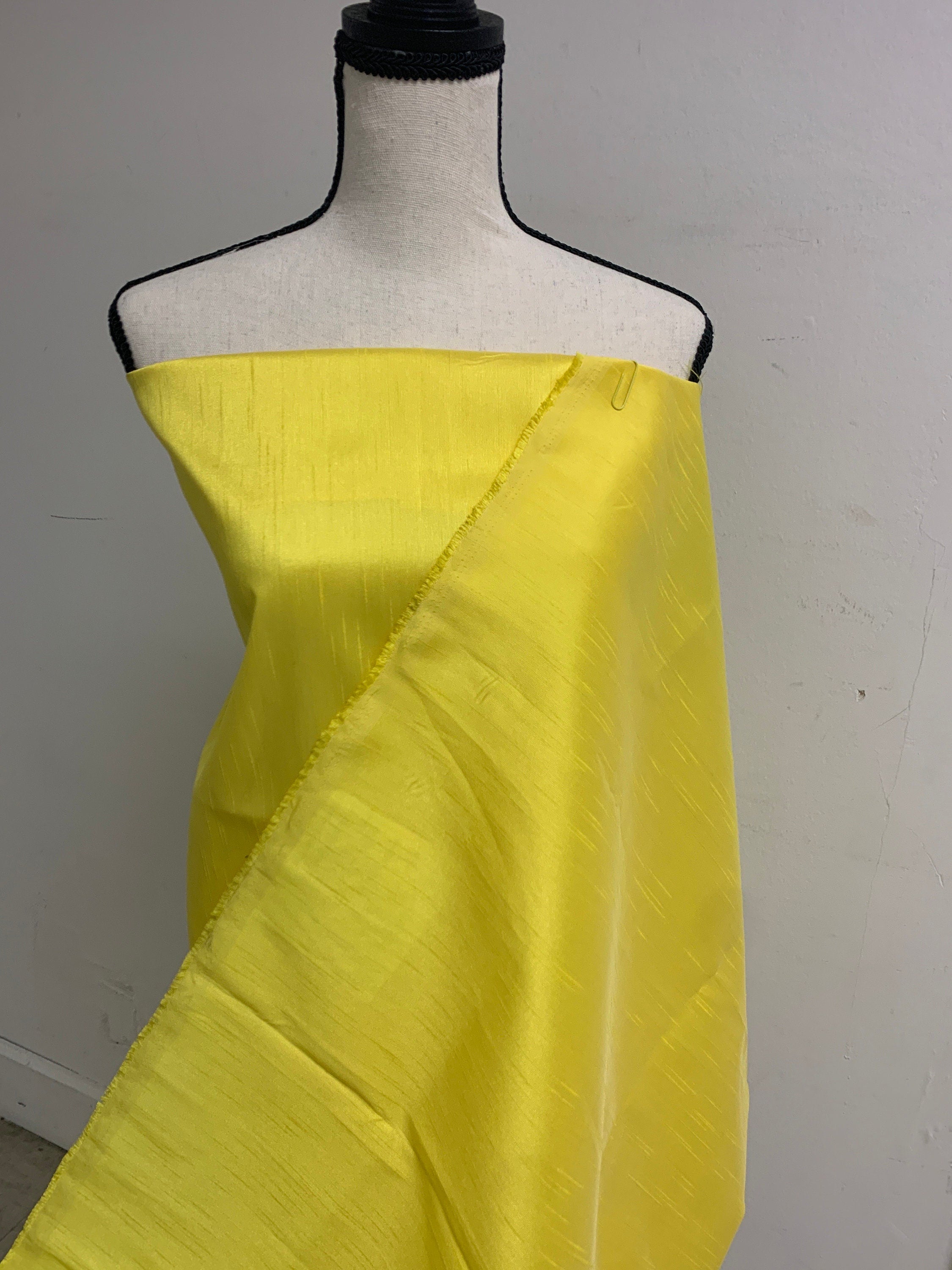 A 2 yards cut Dupioni shantung fabric. Polyester, width 54 inches. color yellow sell by 2 yards cut continuous.
