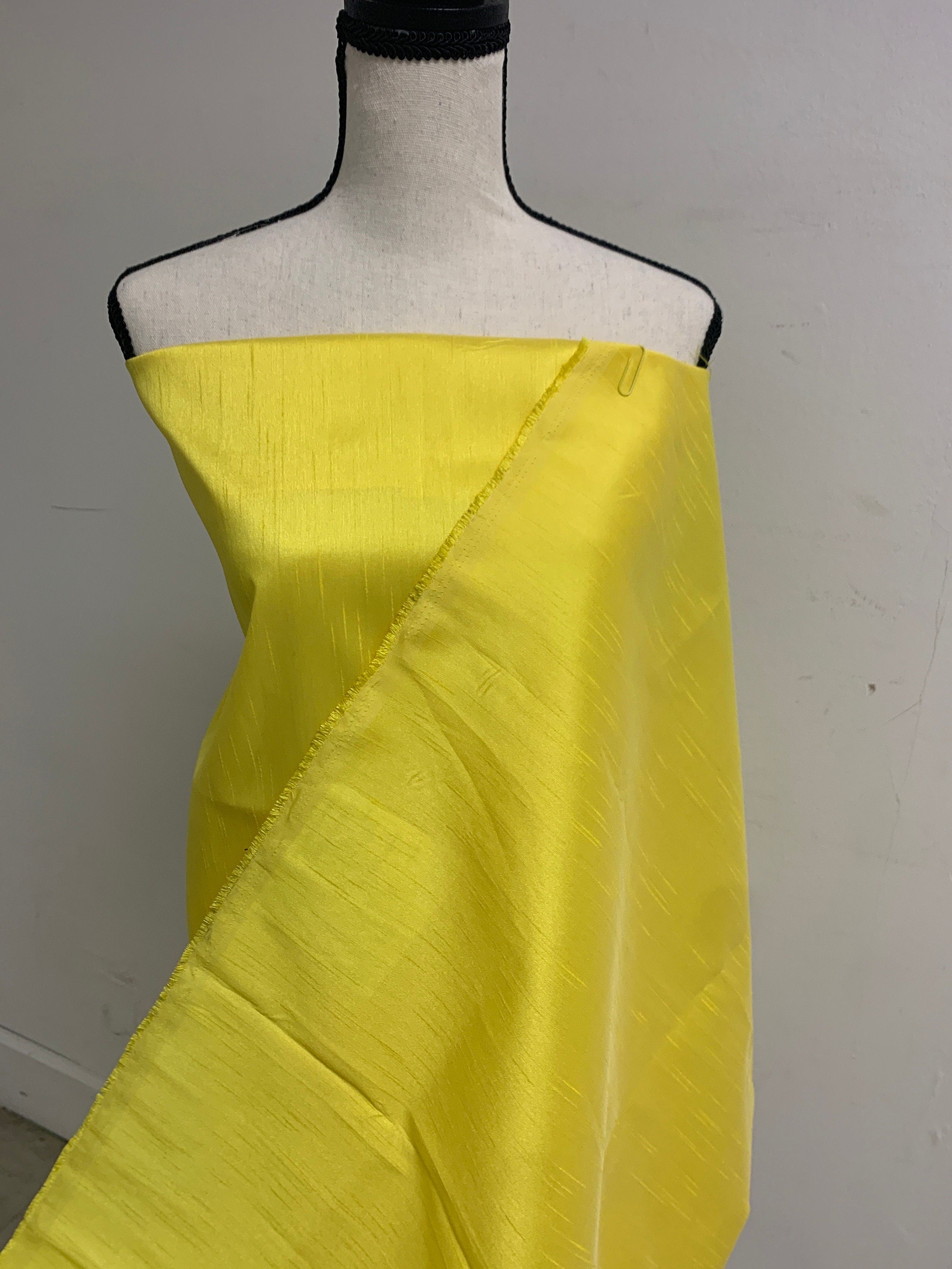 A 2 yards cut Dupioni shantung fabric. Polyester, width 54 inches. color yellow sell by 2 yards cut continuous.