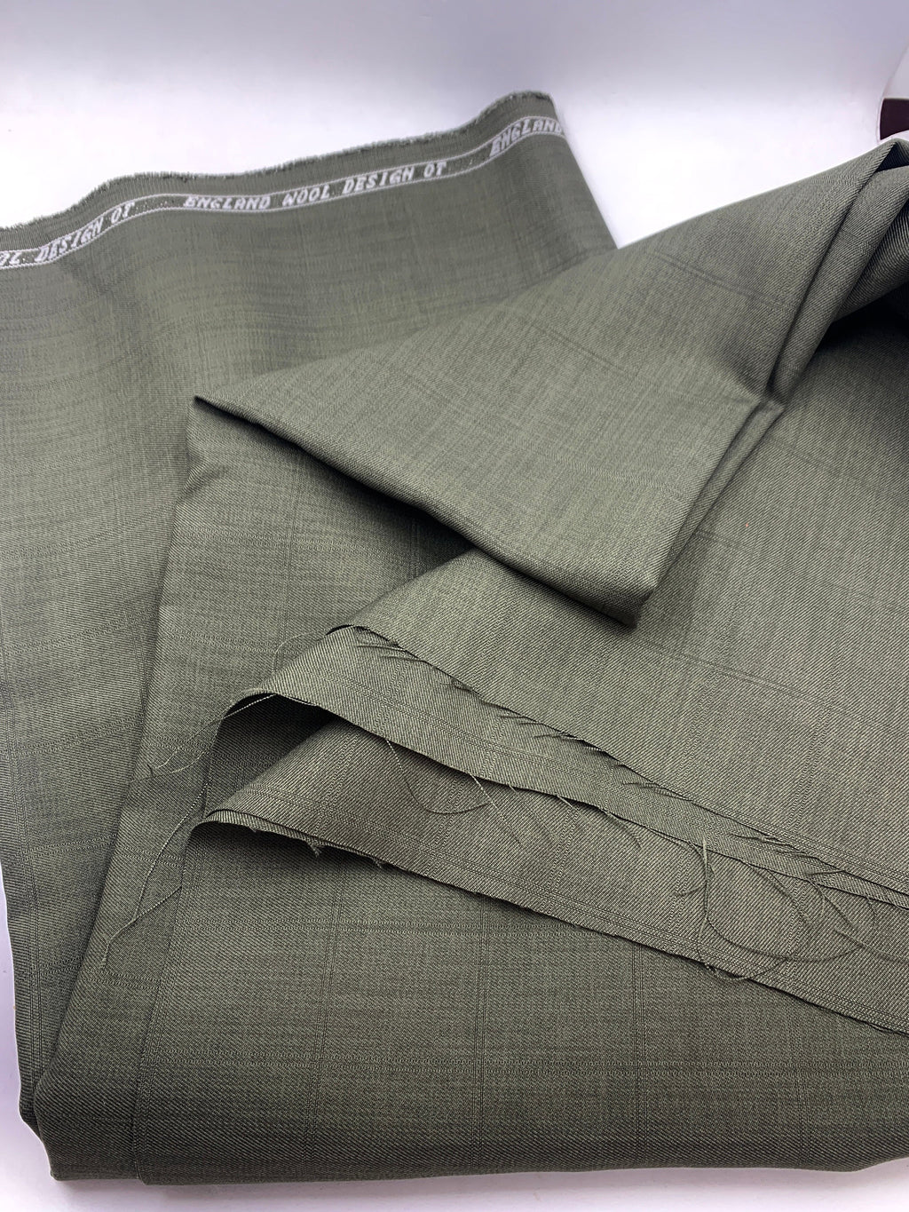 Suiting fabric. Color Sage design 18549E 100% polyester width 58/60 inches. shop with confidence ask for free sample available.